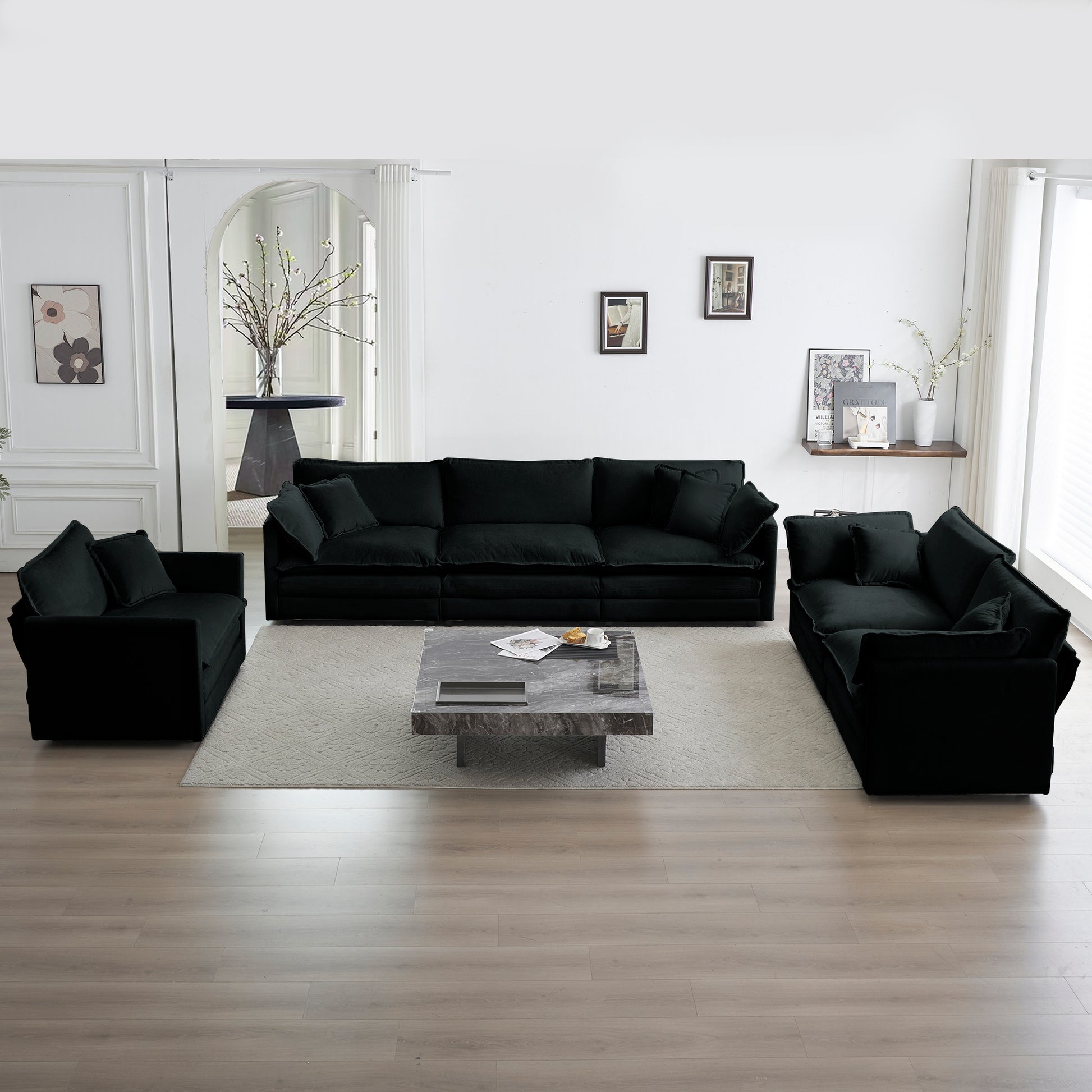 Plush black velvet sectional sofa with deep seats perfect for modern living room comfort