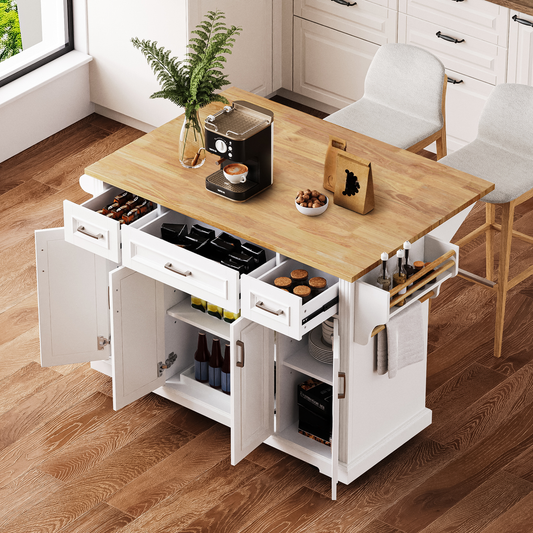 White kitchen island with butcher block top coffee maker and storage drawers