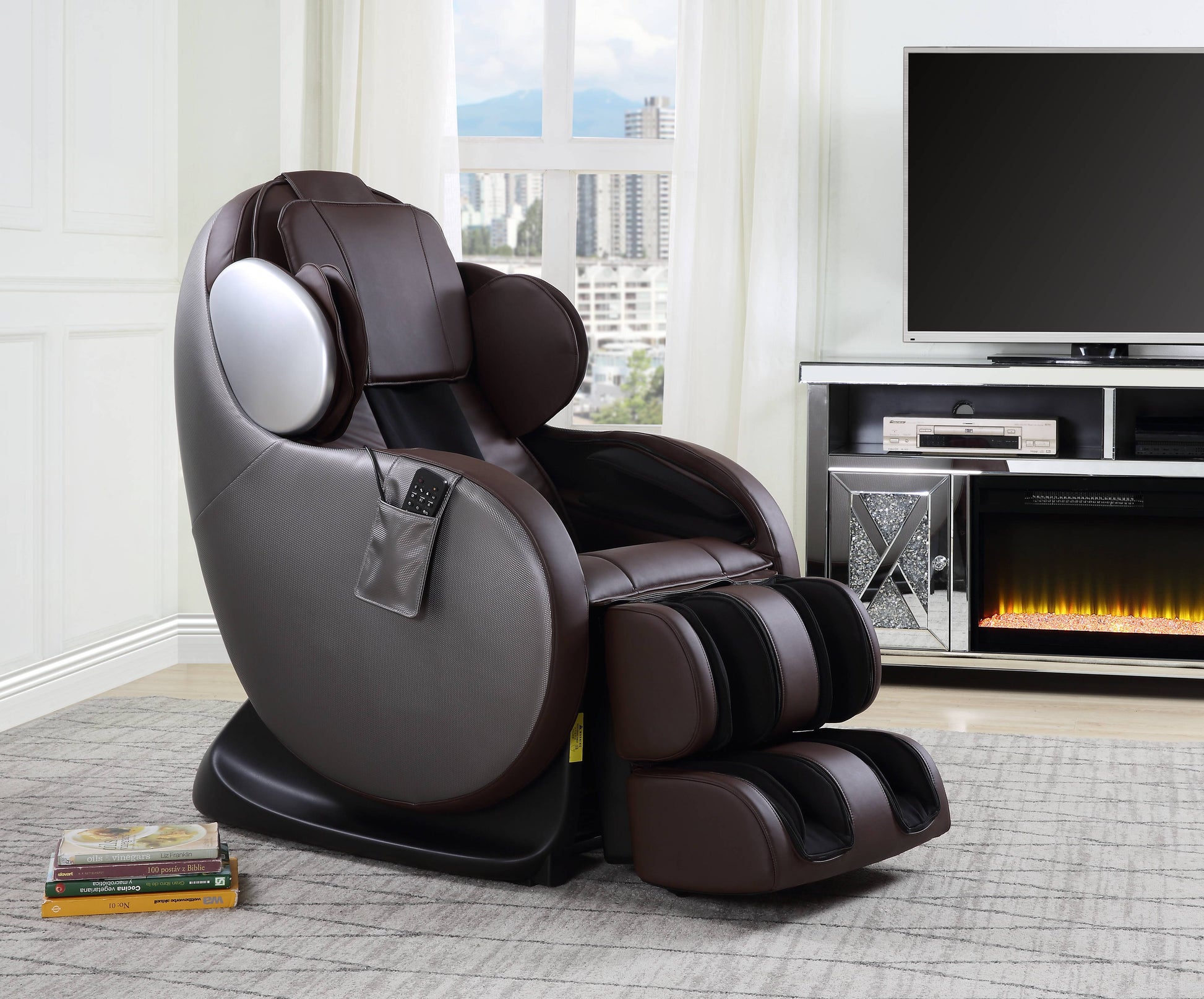 Brown leather massage chair with silver accents and builtin footrest