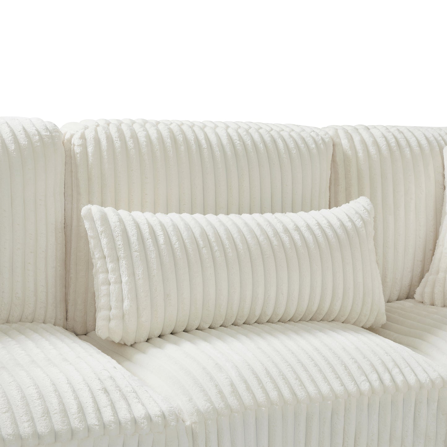 Closeup of plush cream corduroy throw pillow with vertical ribbed texture