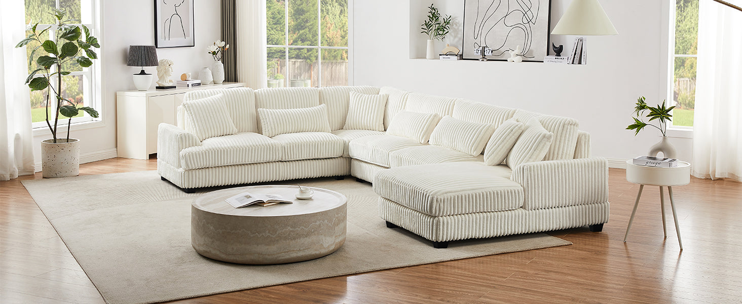 Plush cream corduroy sectional sofa with throw pillows perfect for a cozy living room