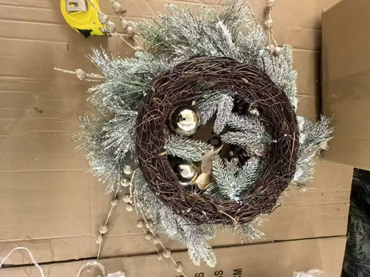 Frosted pine wreath with gold ornaments and glitter accents perfect for holiday decor