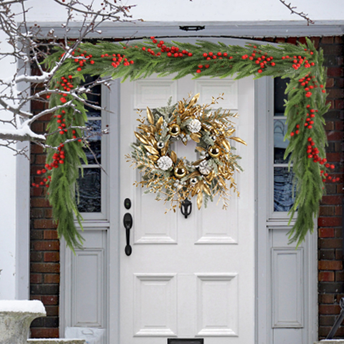 Green pine garland with red berries draped over a white door with a festive wreath