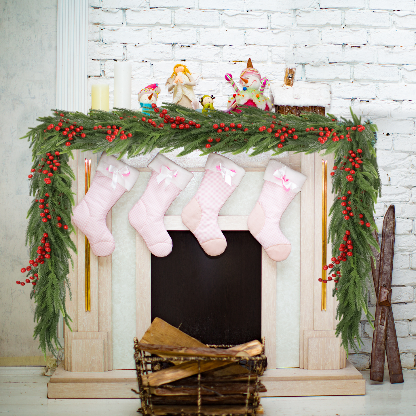 Pink checkered Christmas stockings with white trim and bows hung on mantel