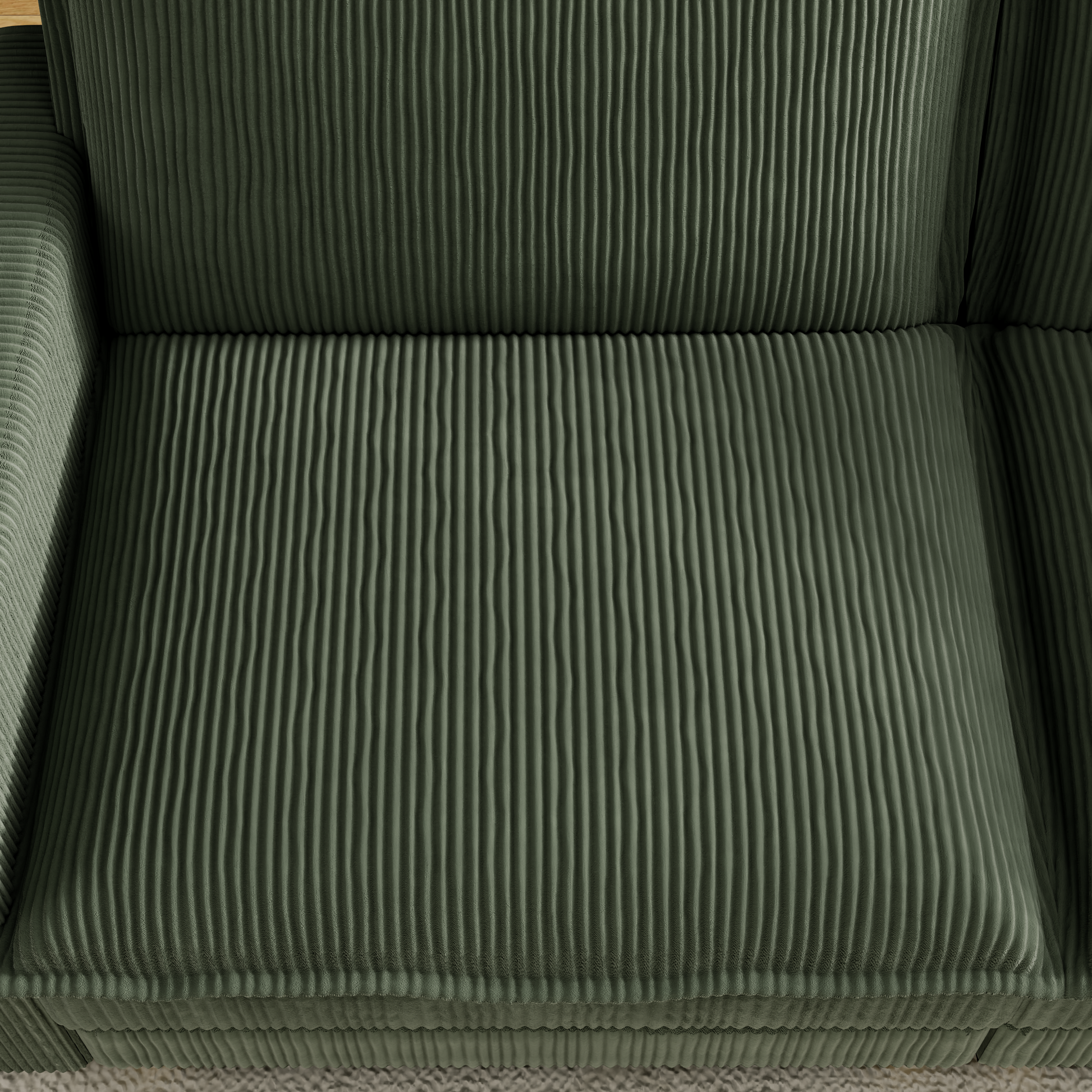 Green corduroy sofa section with deep channel tufting for comfort and style