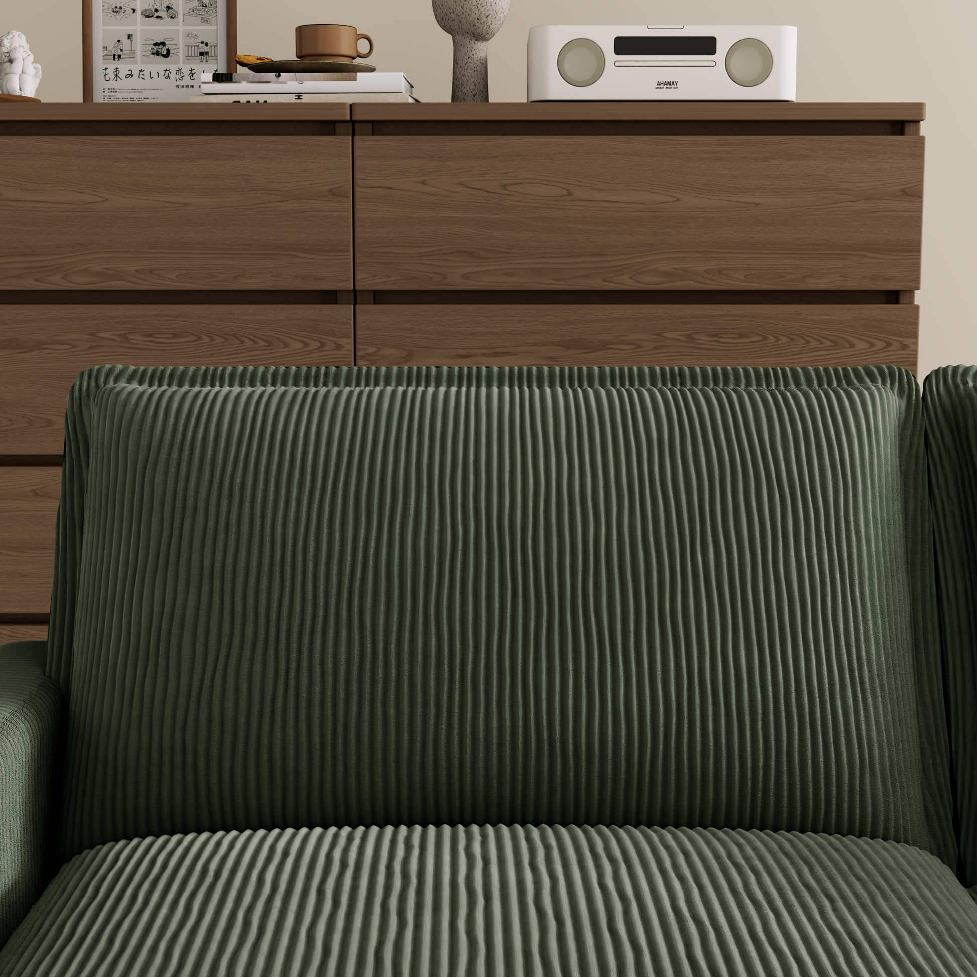 Green corduroy sofa cushion with vertical ribbed texture