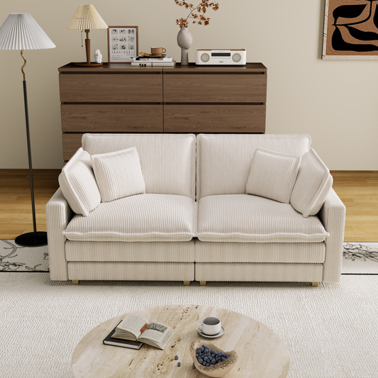 Plush cream corduroy sofa with channel tufting and throw pillows perfect for modern living rooms