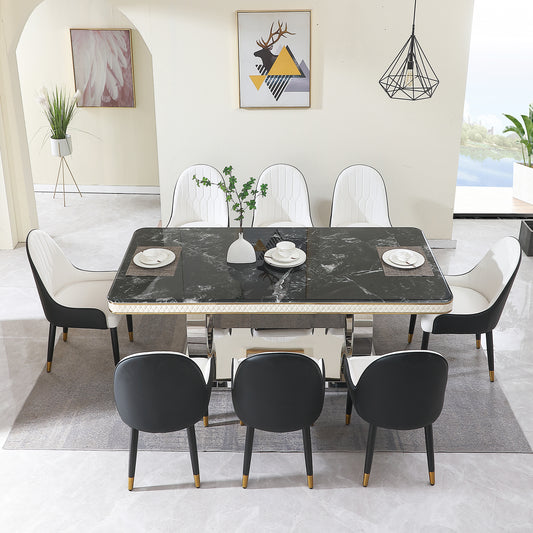 Modern black marble dining table set with white and black upholstered chairs