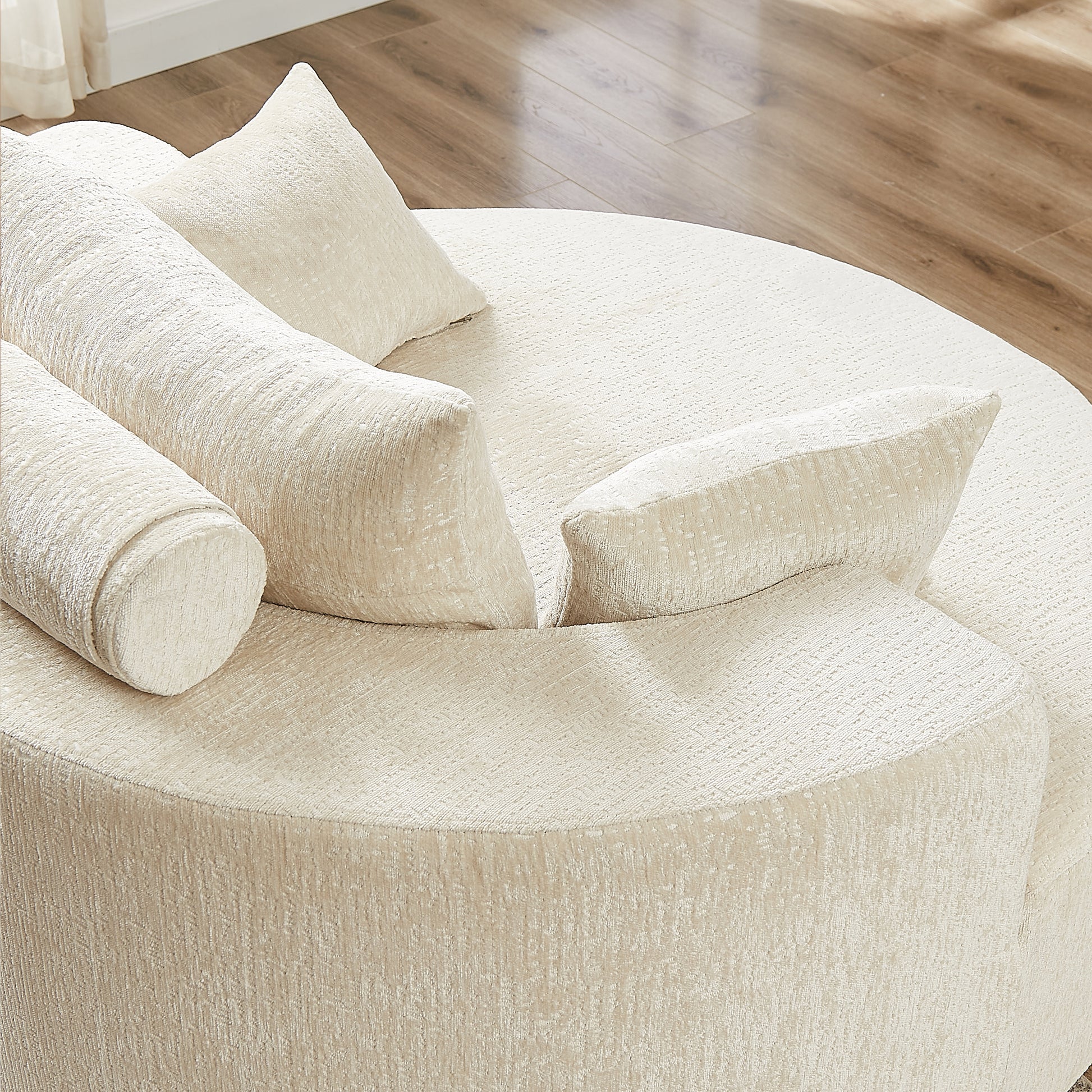 Cream textured circular sofa with plush cushions modern living room furniture
