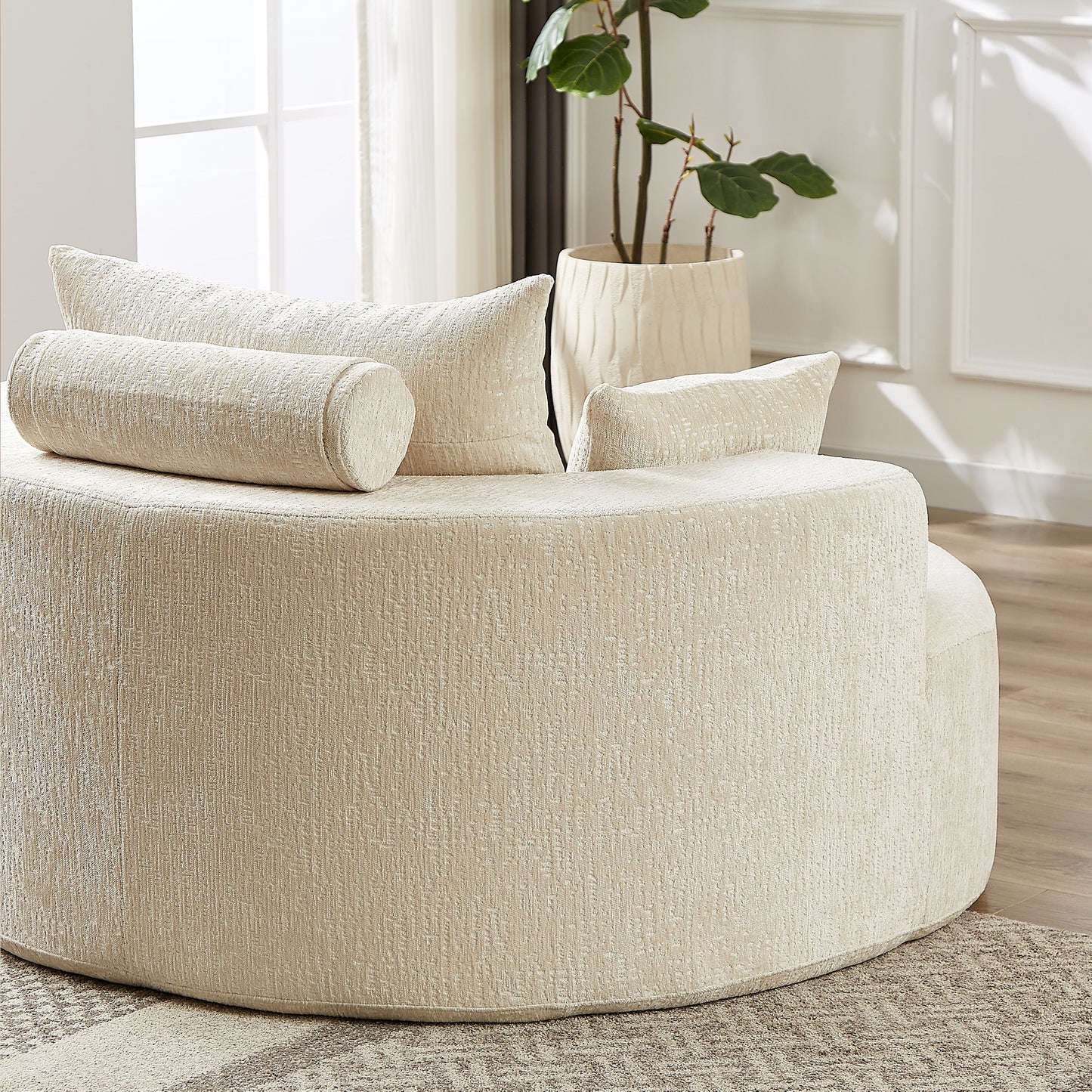 Plush beige boucle fabric accent chair with rounded arms and bolster pillows for luxurious comfort