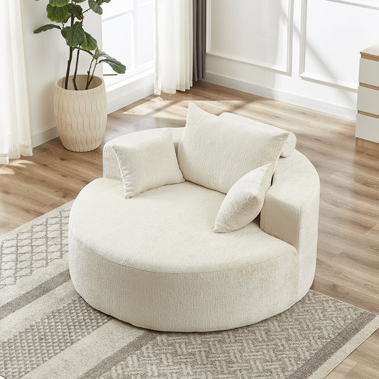 Plush cream boucle circular sofa with accent pillows on a geometric rug