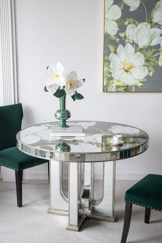 Mirrored Art Deco dining table with floral inlay and green velvet chairs