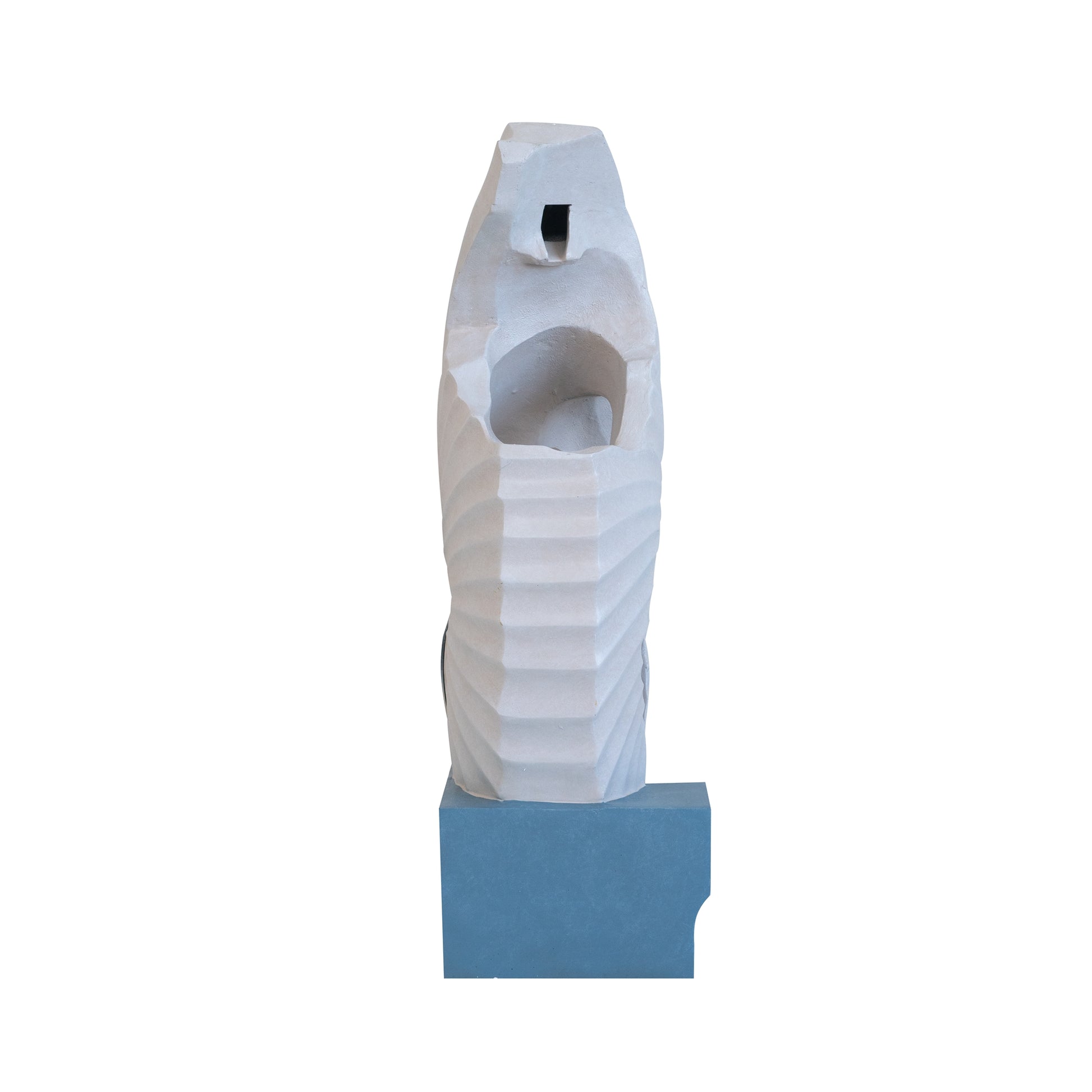 Sculptural concrete fountain with a textured ribbed body and a geometric opening