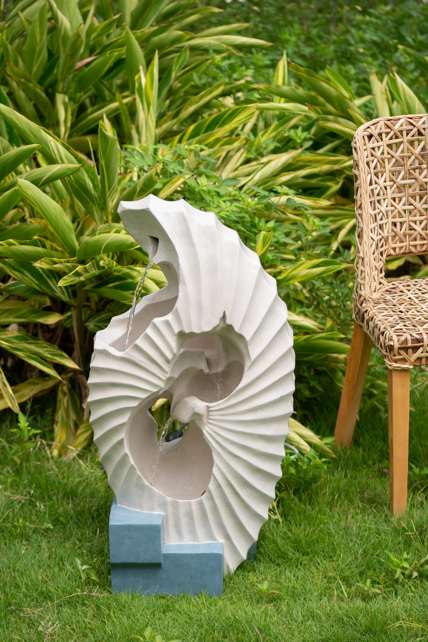 Modern concrete garden fountain with cascading water spiral design
