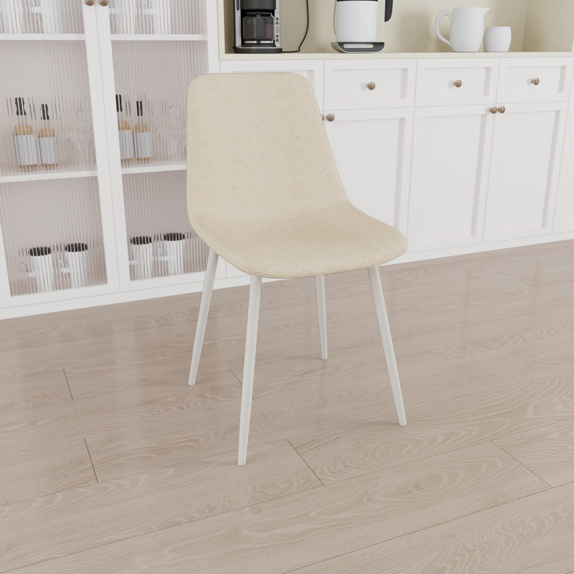 Cream fabric dining chair with white metal legs ideal for a modern kitchen