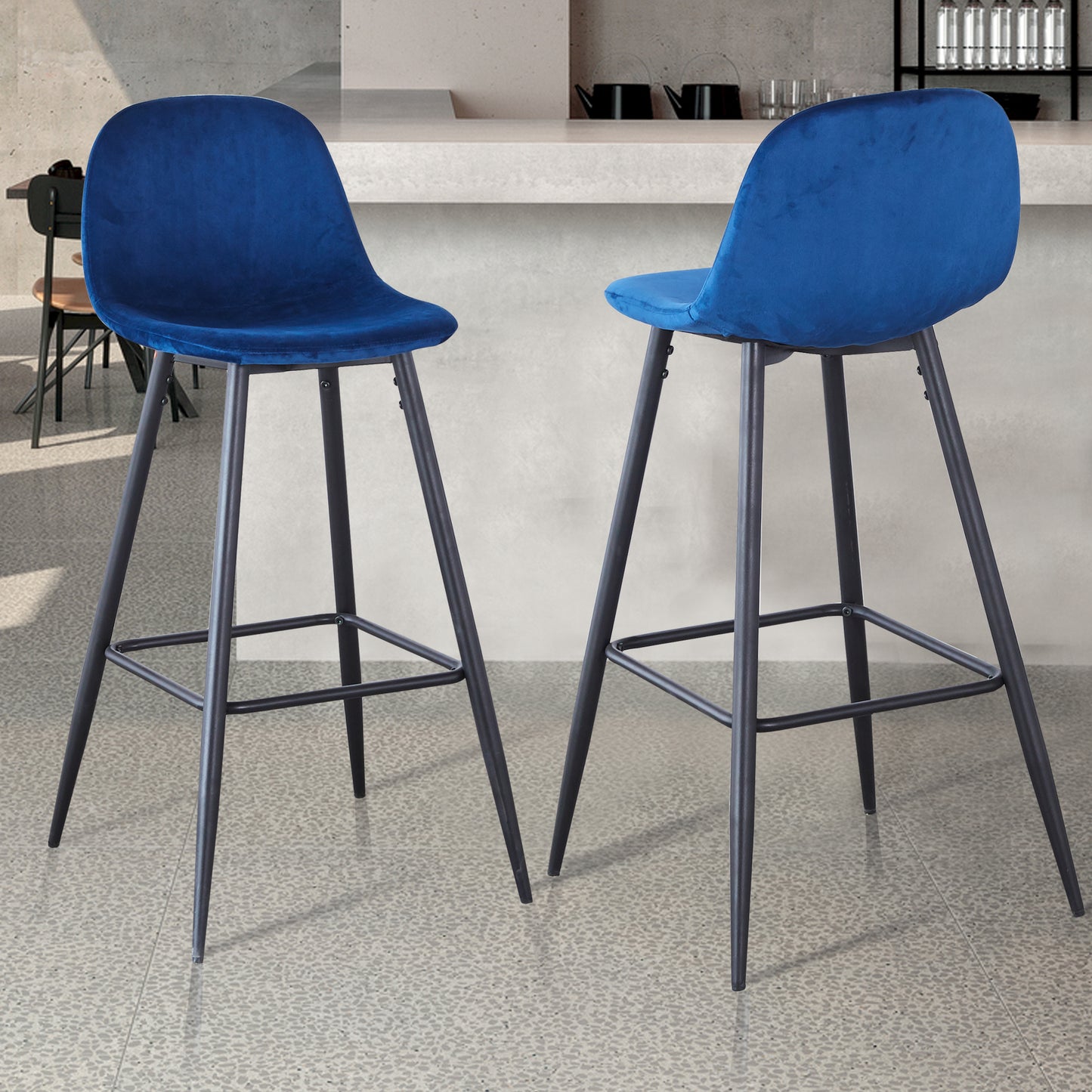 Two plush royal blue velvet bar stools with black metal legs perfect for a modern kitchen island