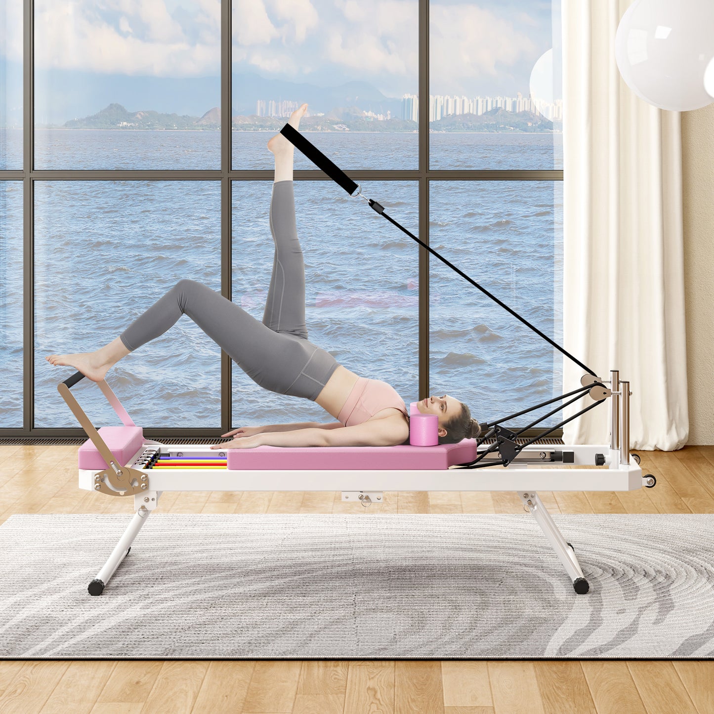 Pink reformer pilates machine with diverse resistance springs and a woman exercising