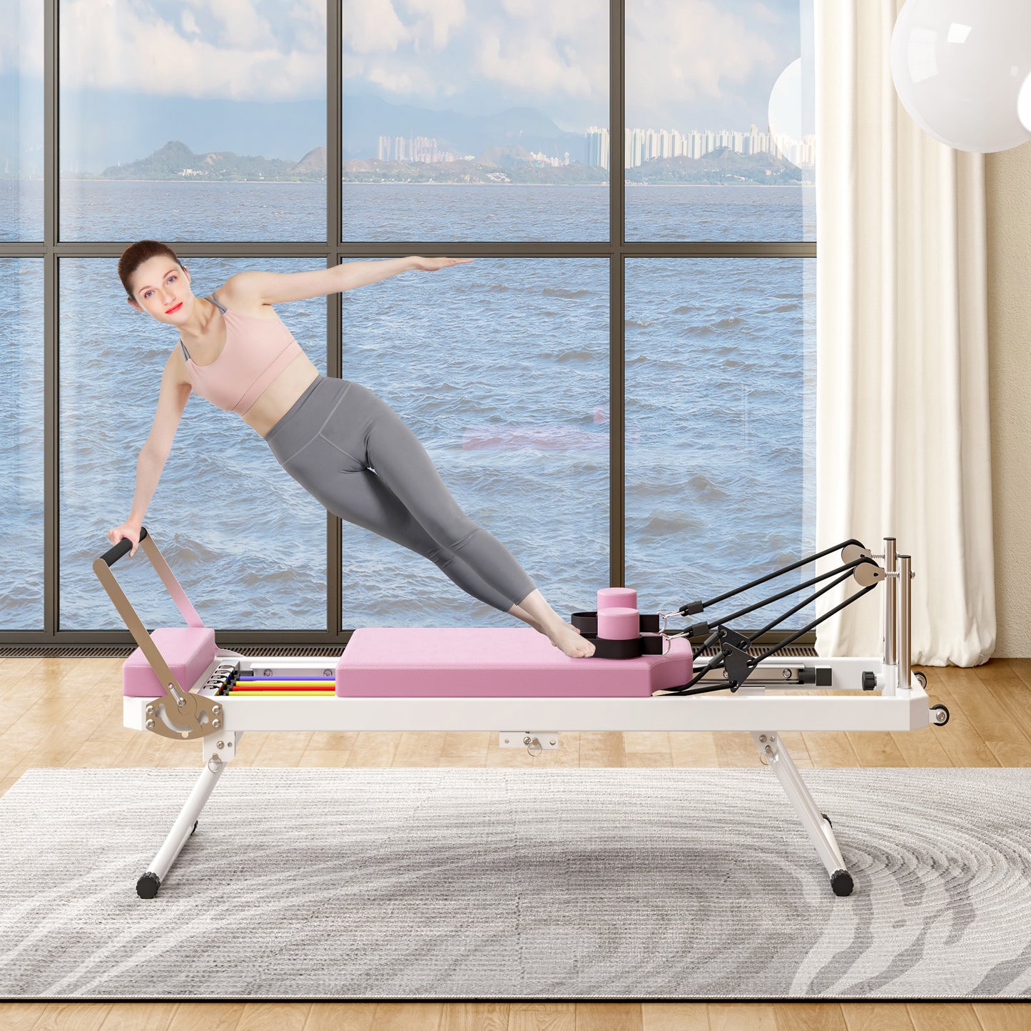 Pink Pilates reformer with resistance springs and carriage for home workouts