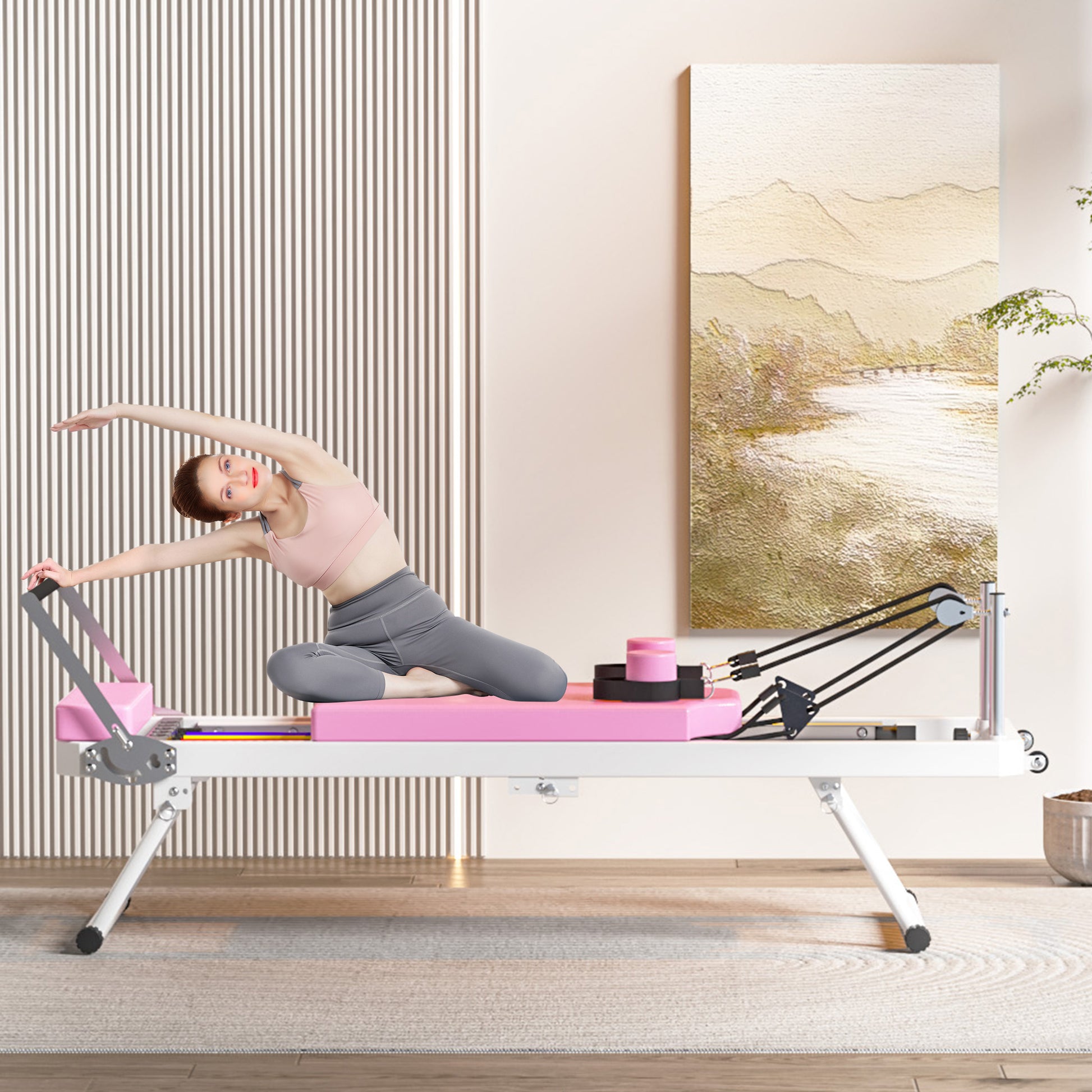 Pink and white Pilates reformer with a woman exercising ideal for home fitness