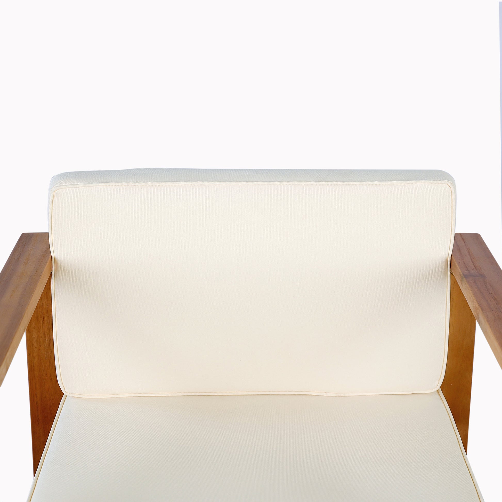 Cream cushioned armchair with solid wood frame ideal for patio furniture