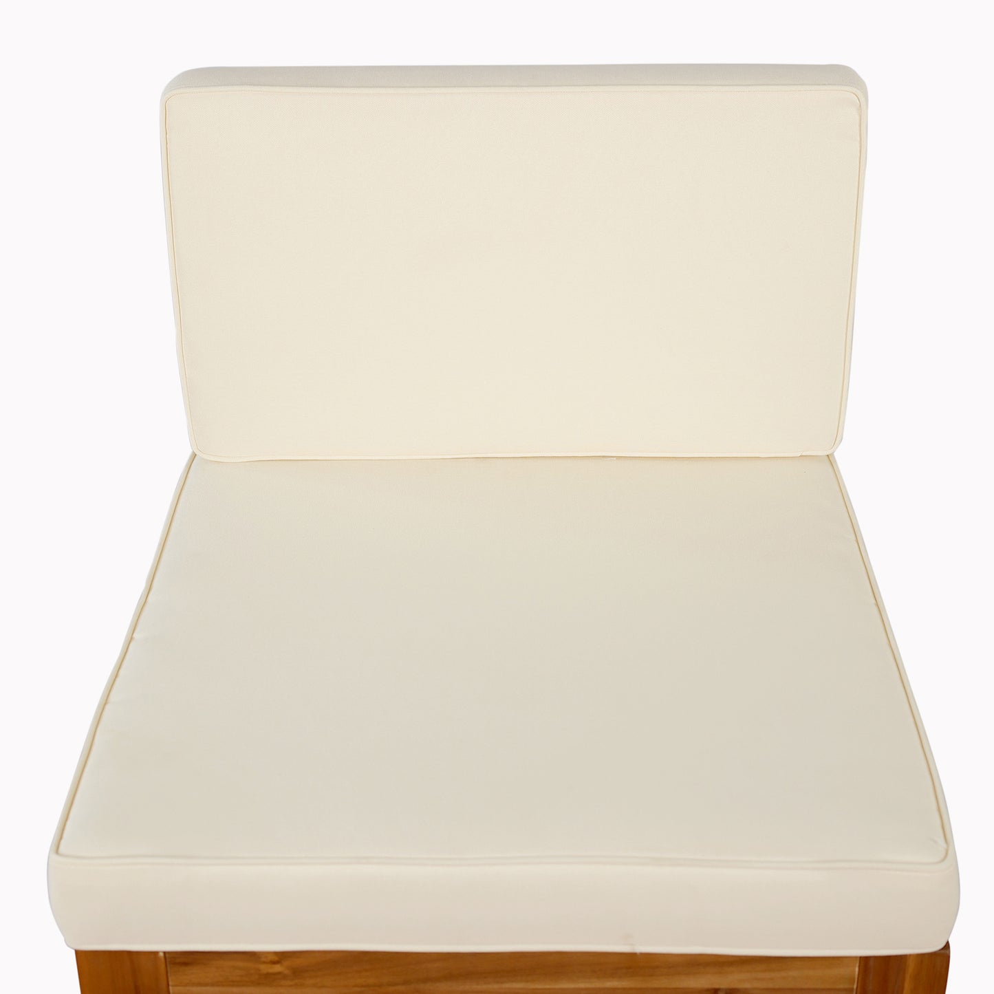 Cream outdoor chair cushion with piped edges on wooden frame