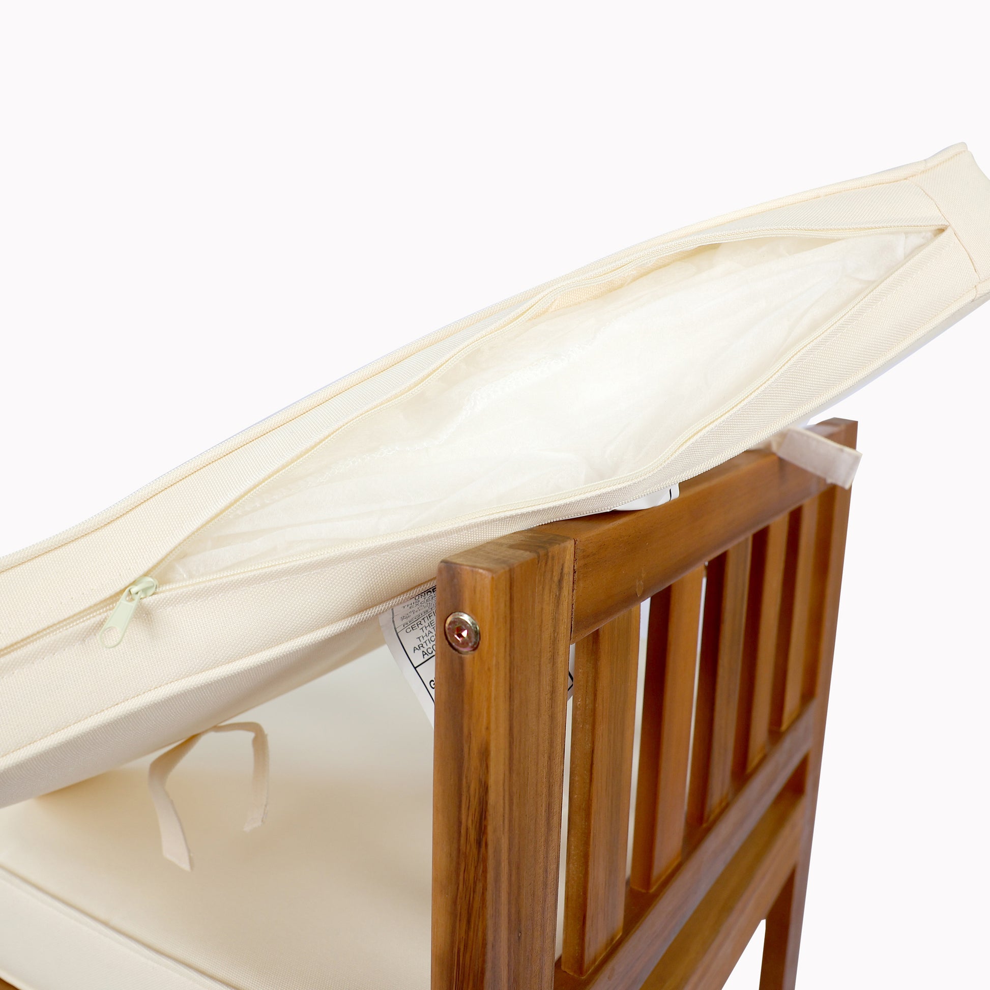 Cream outdoor chair cushion with zippered cover and fabric ties