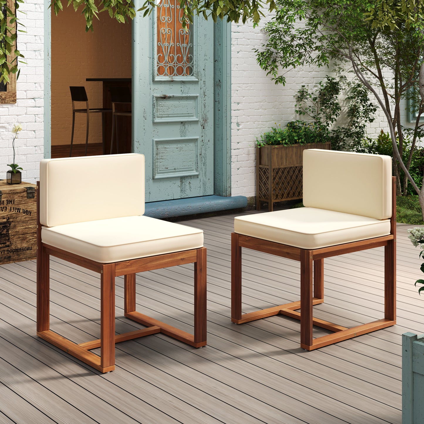 Two modern wooden outdoor chairs with cream cushions on a deck