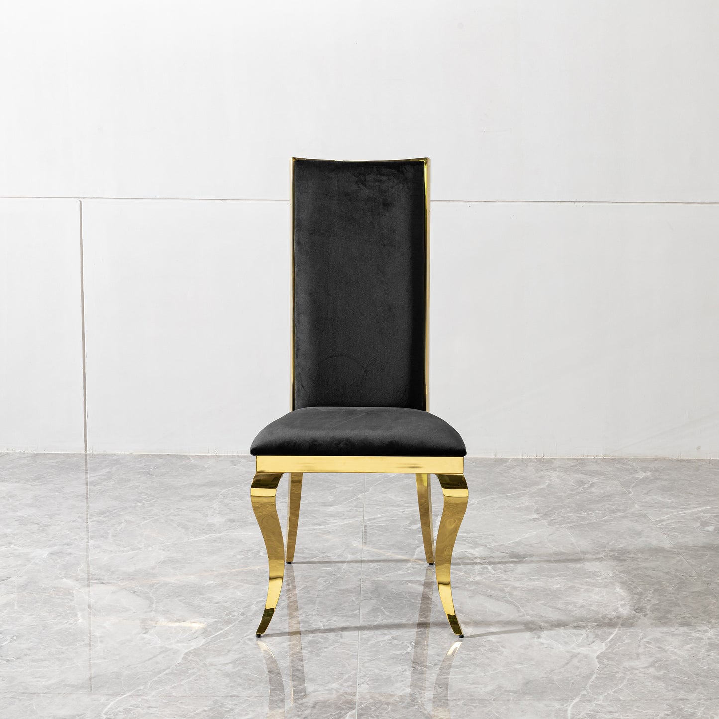 Black velvet dining chair with polished gold metal legs and frame
