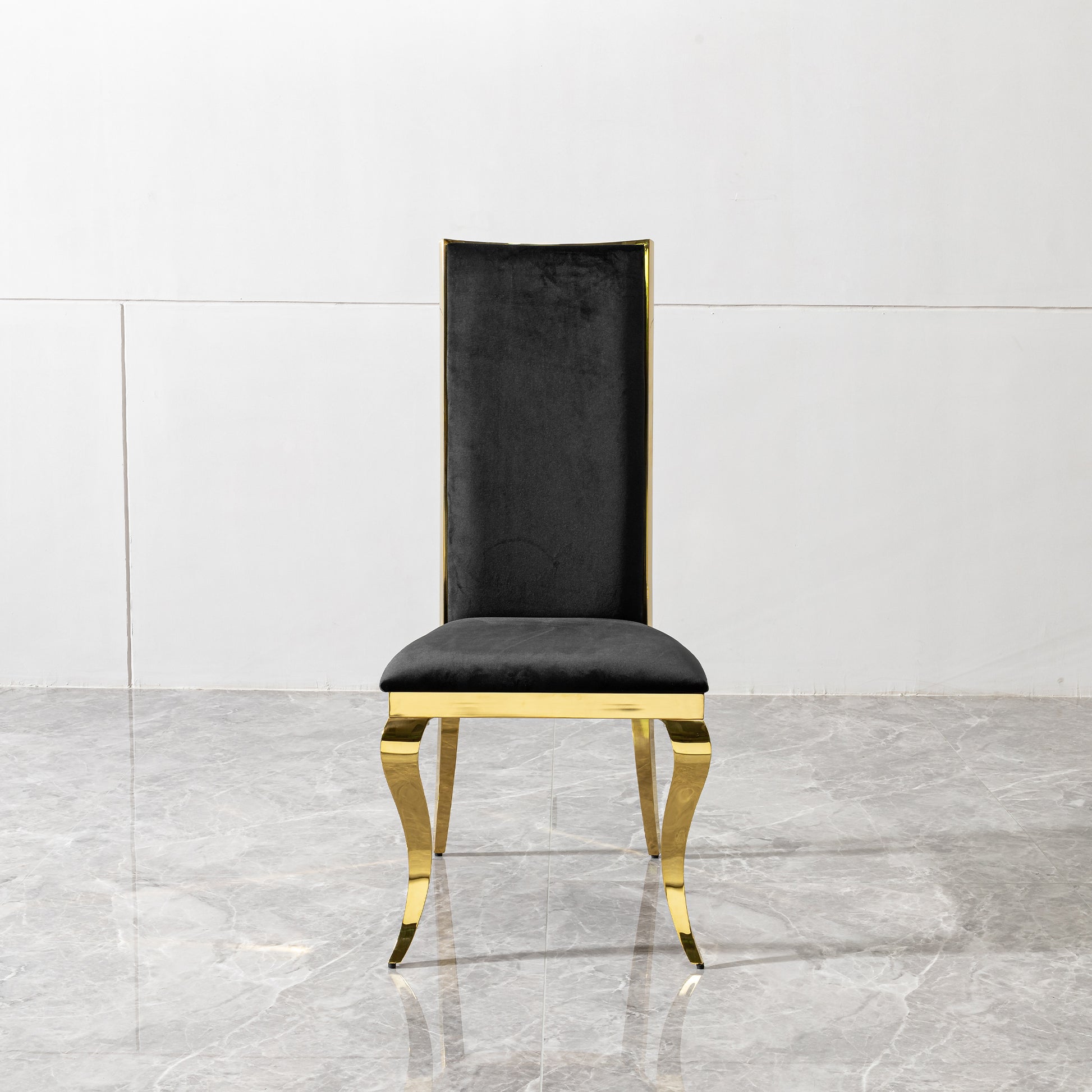 Black velvet dining chair with polished gold metal legs and frame