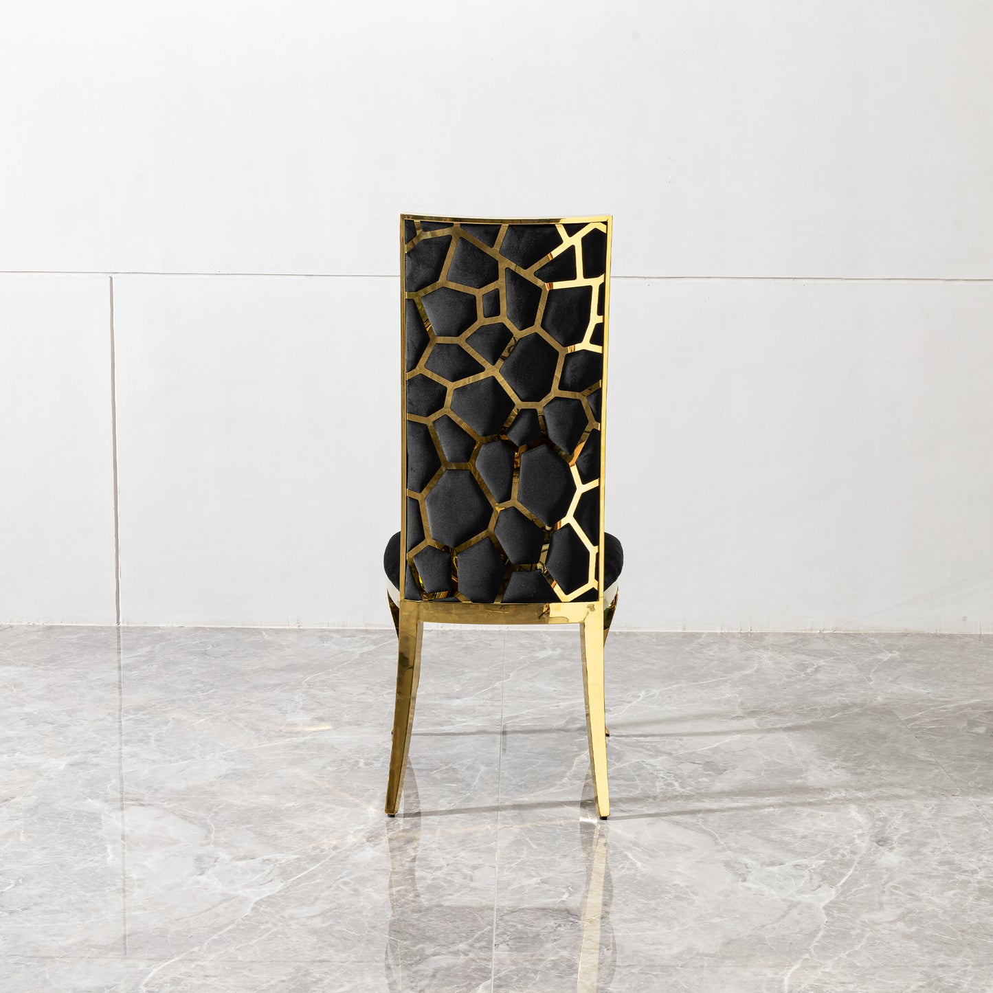 Black velvet dining chair with gold geometric back and legs