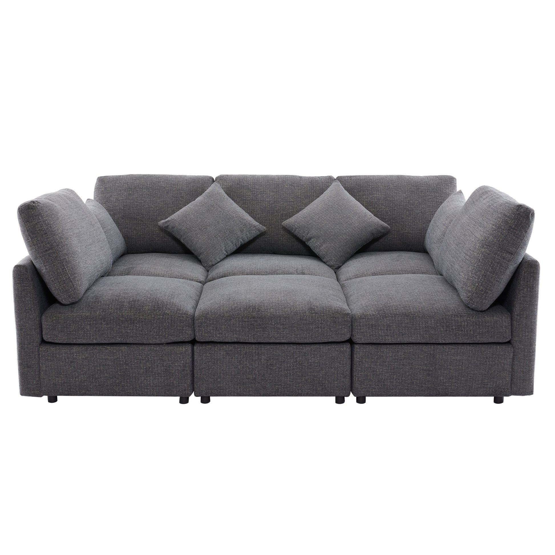 Charcoal gray modular fabric sofa with three seats and accent pillows