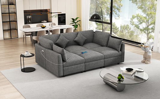 Modern sectional sofa in charcoal gray fabric with integrated USB charging ports for home entertainment