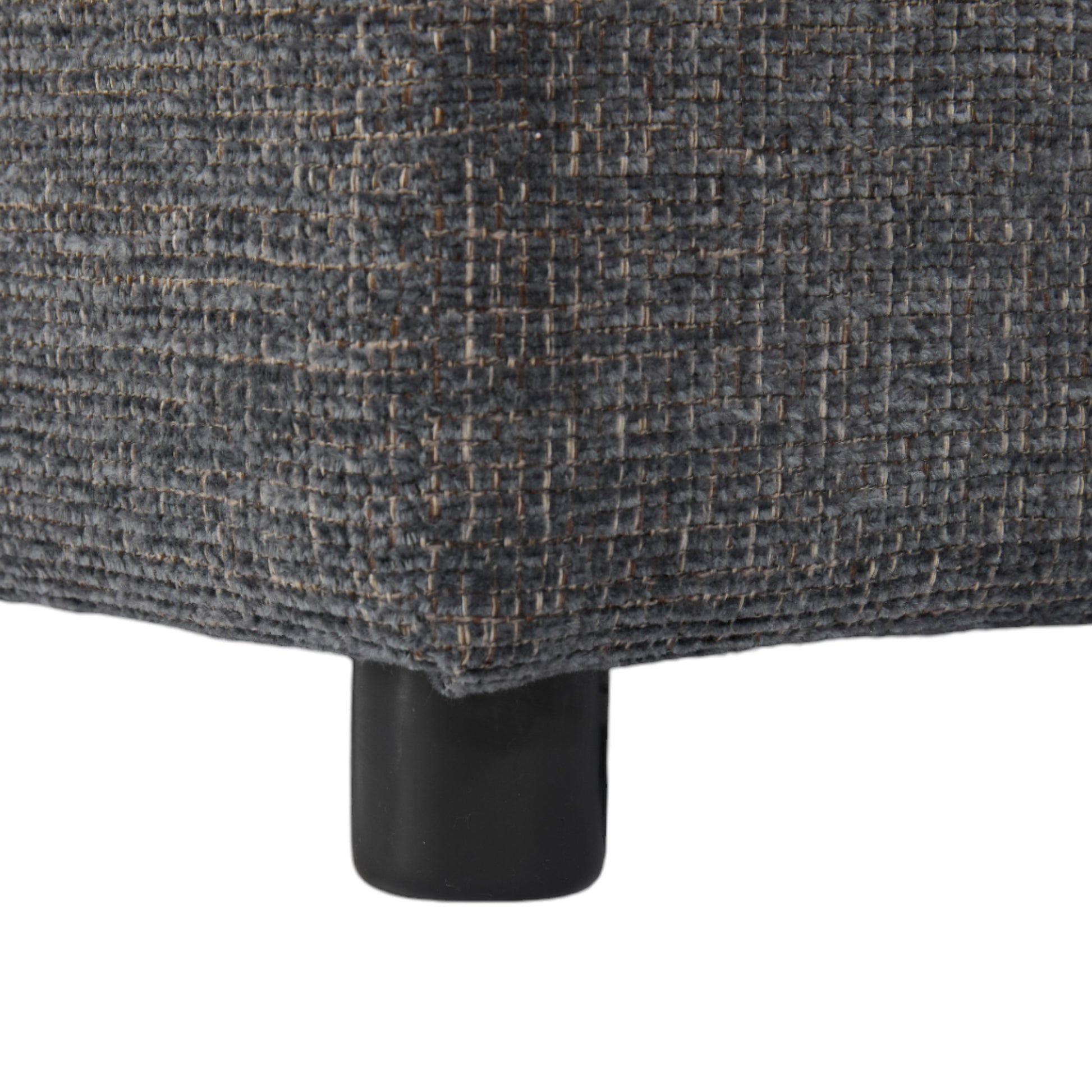 Closeup of textured charcoal gray fabric on a modern furniture leg