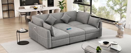 Grey upholstered modular sofa with plush cushions and integrated USB charging port
