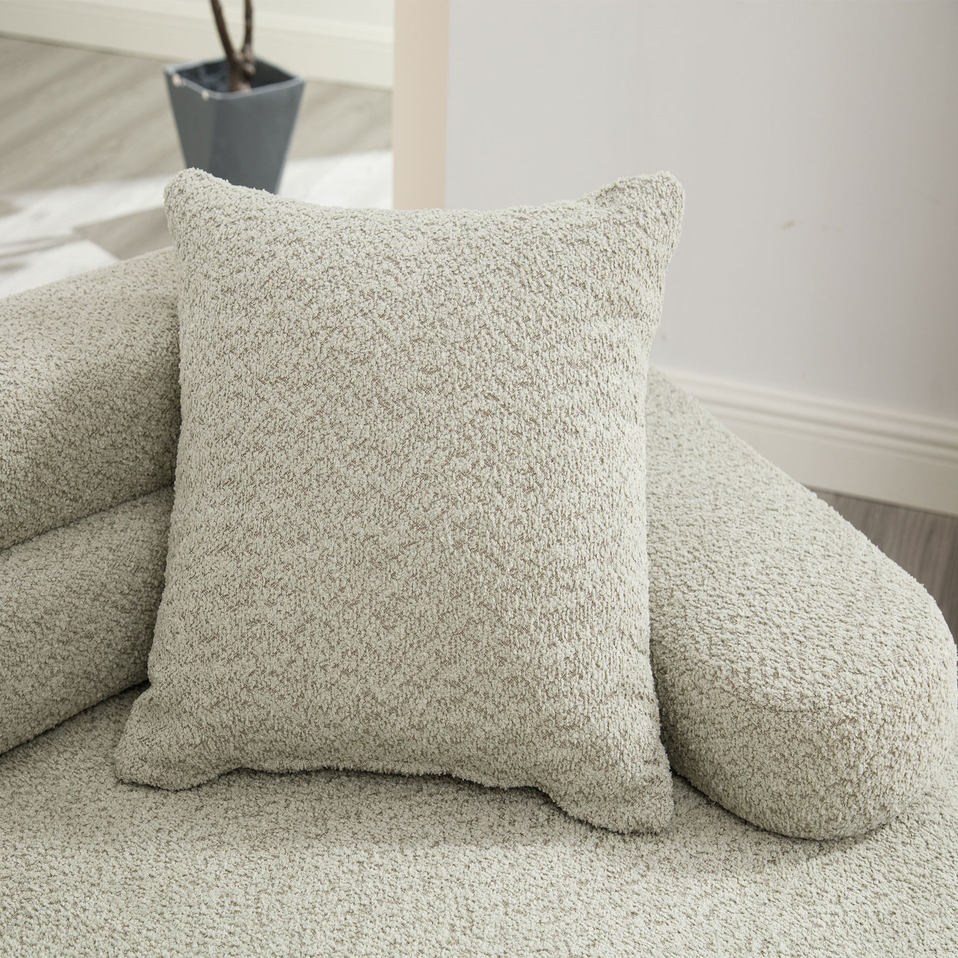 Cozy chenille boucle pillow in light beige perfect for sofa comfort