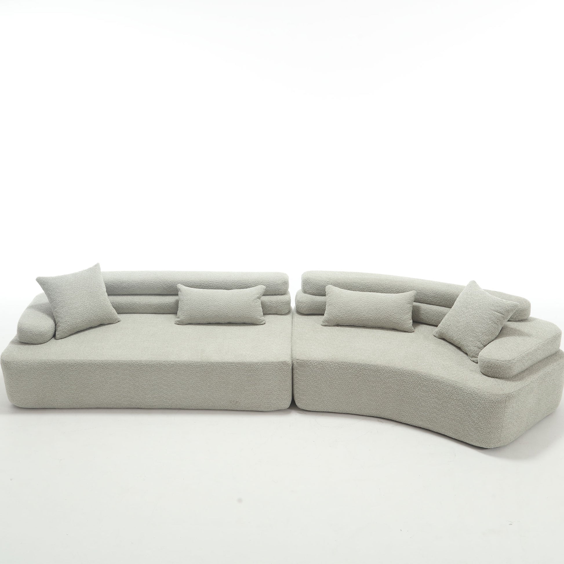 Soft grey textured modular sectional sofa with plush throw pillows for ultimate comfort
