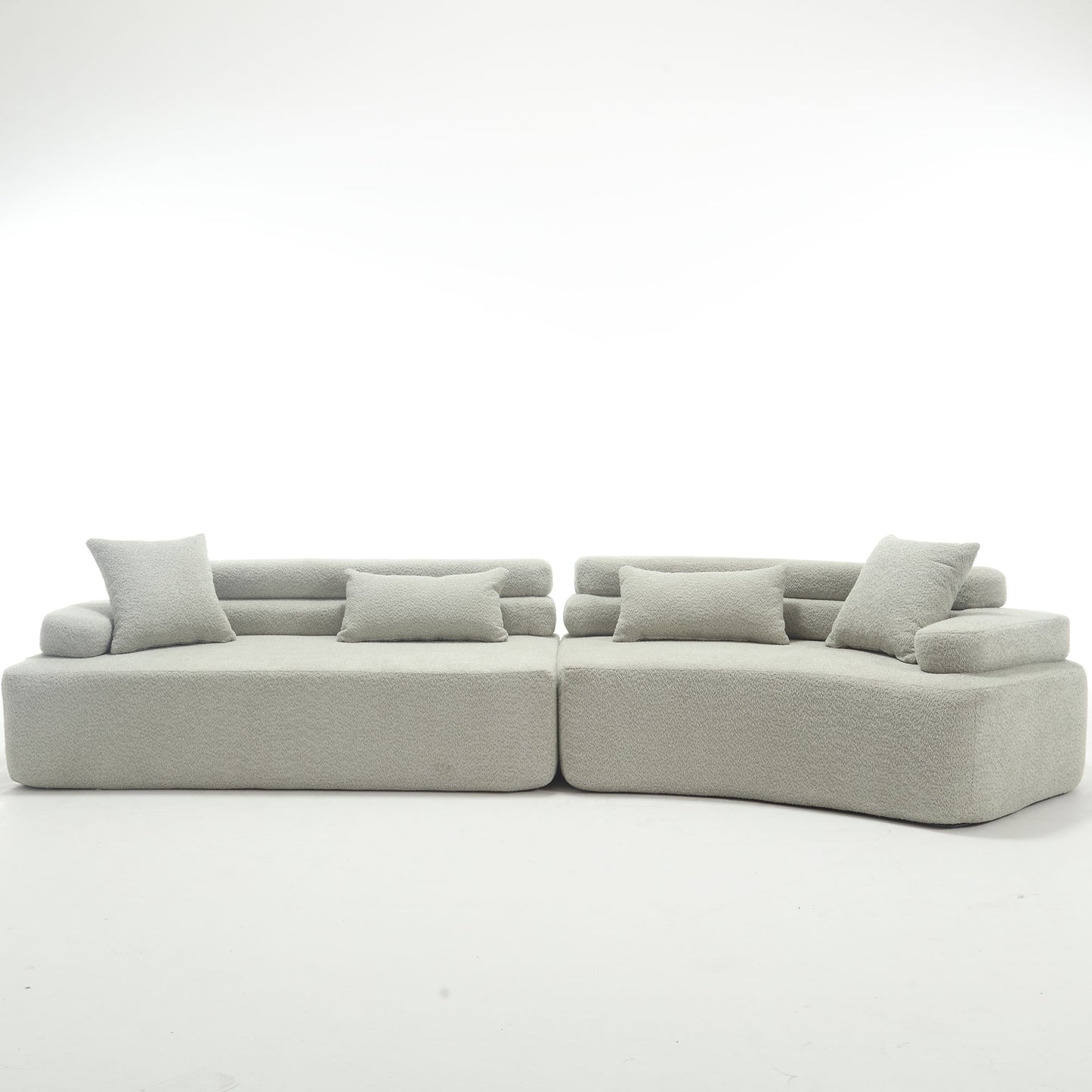 Plush light gray sectional sofa with rounded arms and matching cushions for modern living rooms