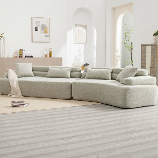 Plush boucle fabric sectional sofa in a light gray perfect for a modern living room