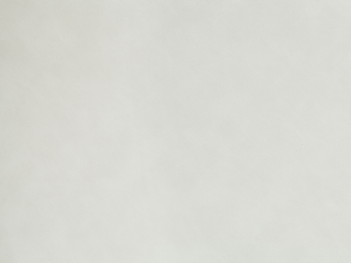 Closeup of textured offwhite faux leather material perfect for upholstery projects