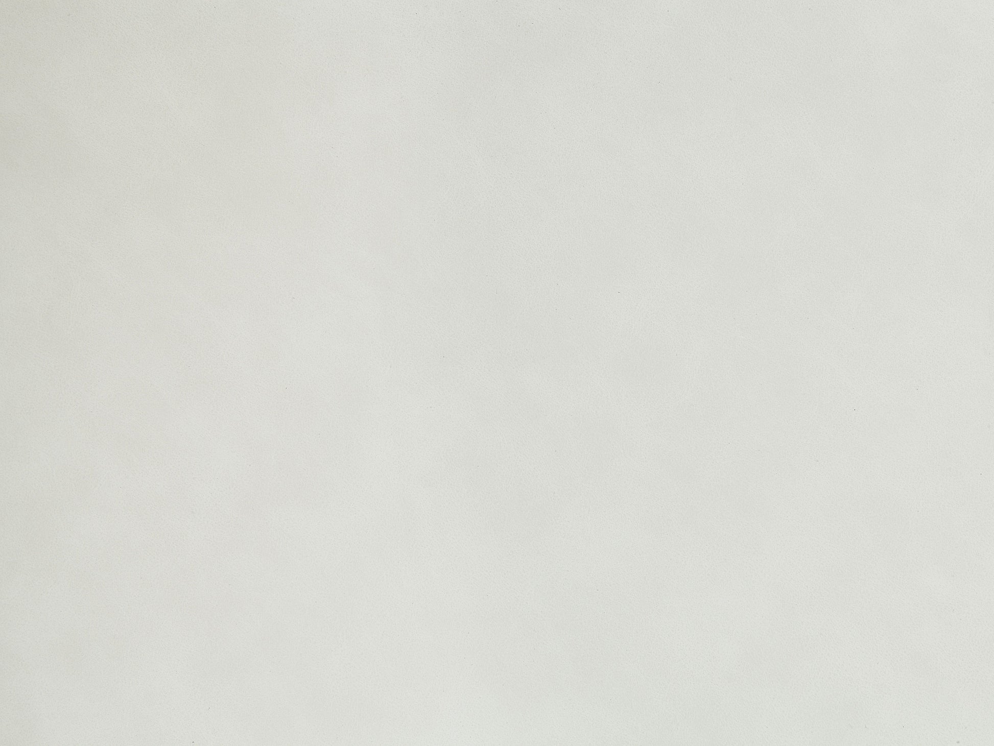 Closeup of textured offwhite faux leather material perfect for upholstery projects