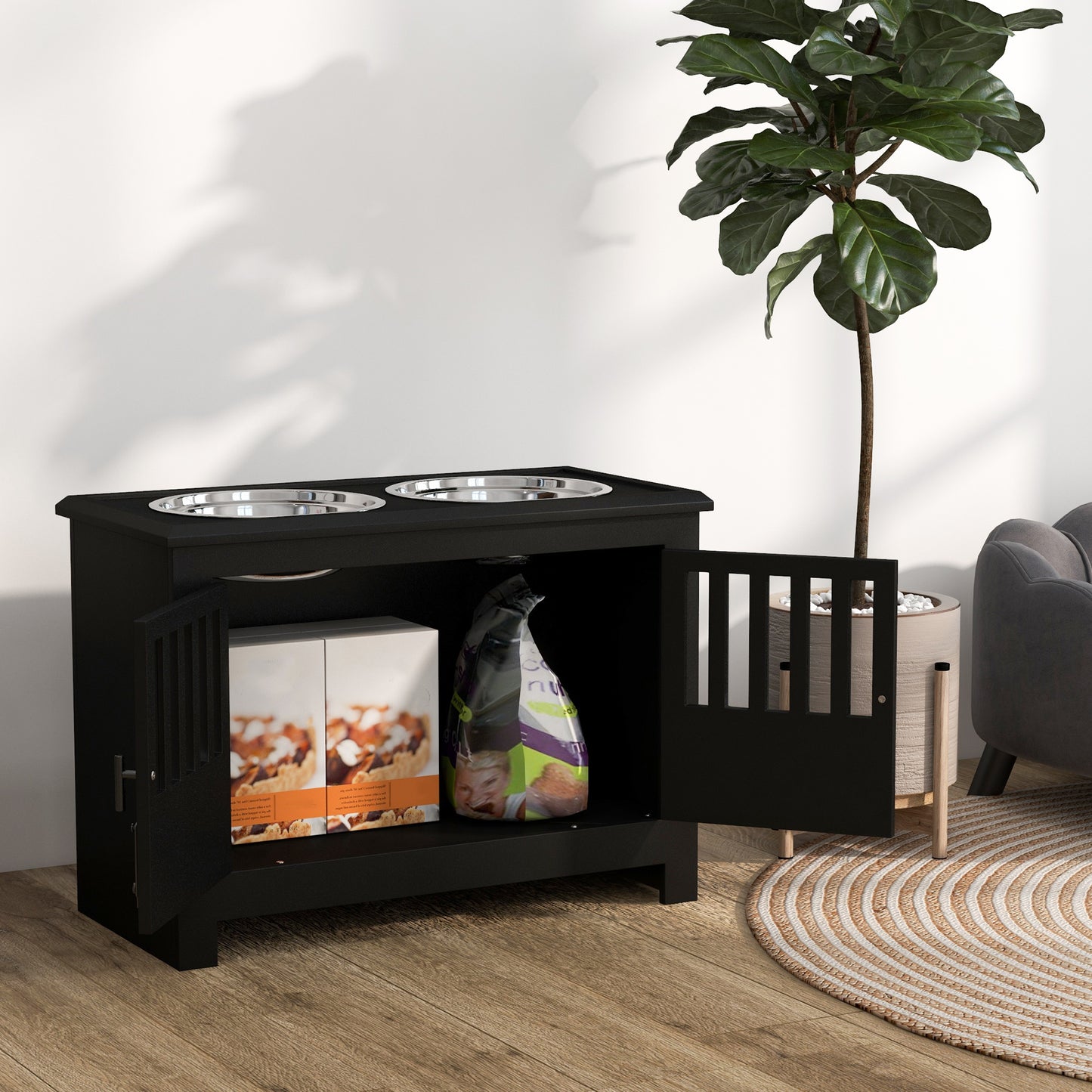 Black wooden dog food cabinet with two stainless steel bowls and storage for treats