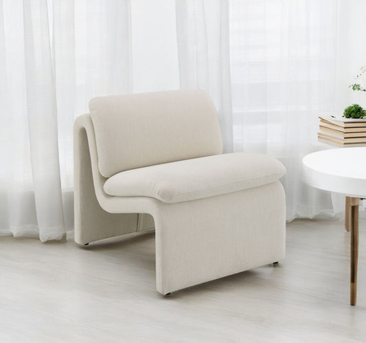 Cream fabric accent chair with curved modern design and plush cushions for living room seating