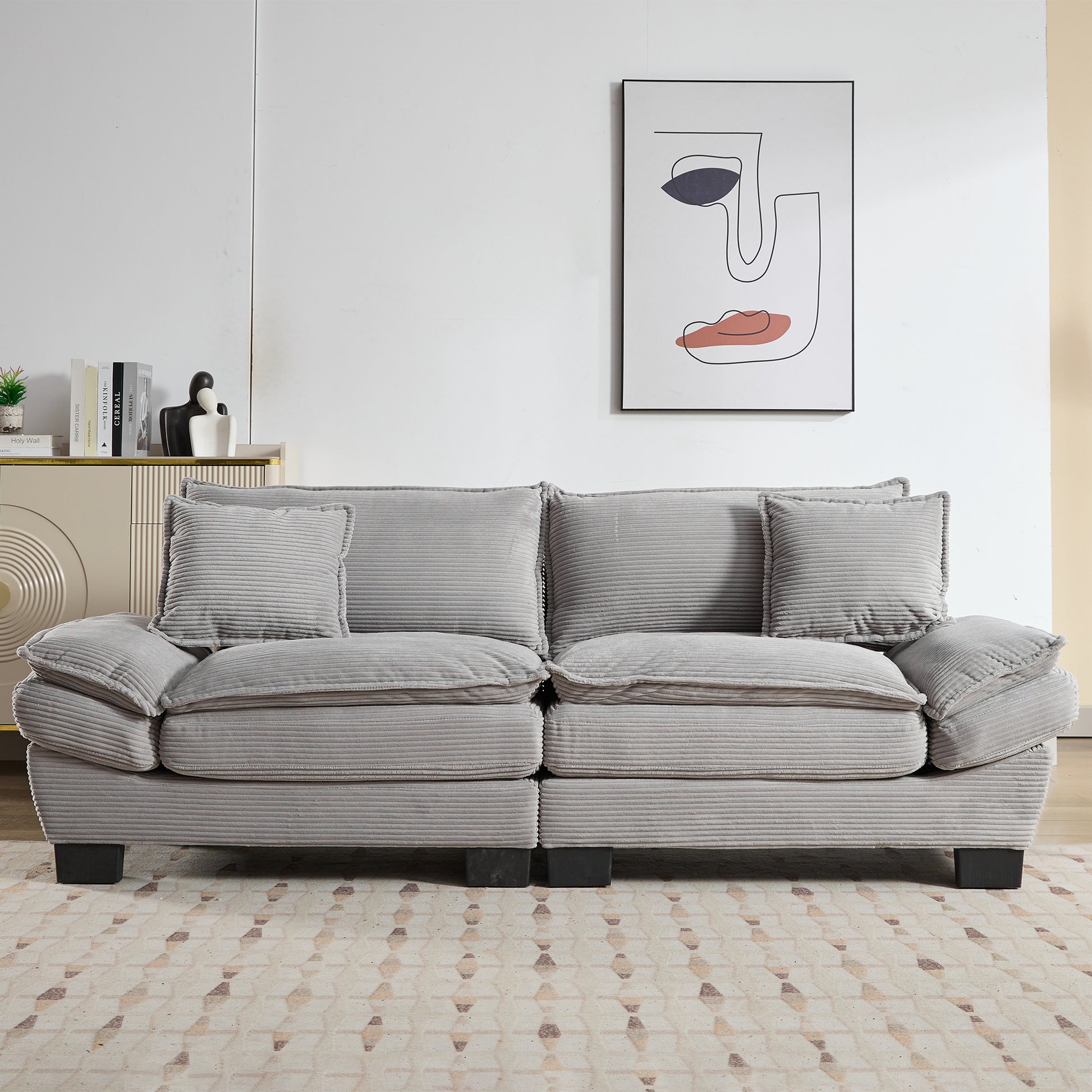 Plush grey corduroy sofa with deep cushions and matching accent pillows for ultimate comfort