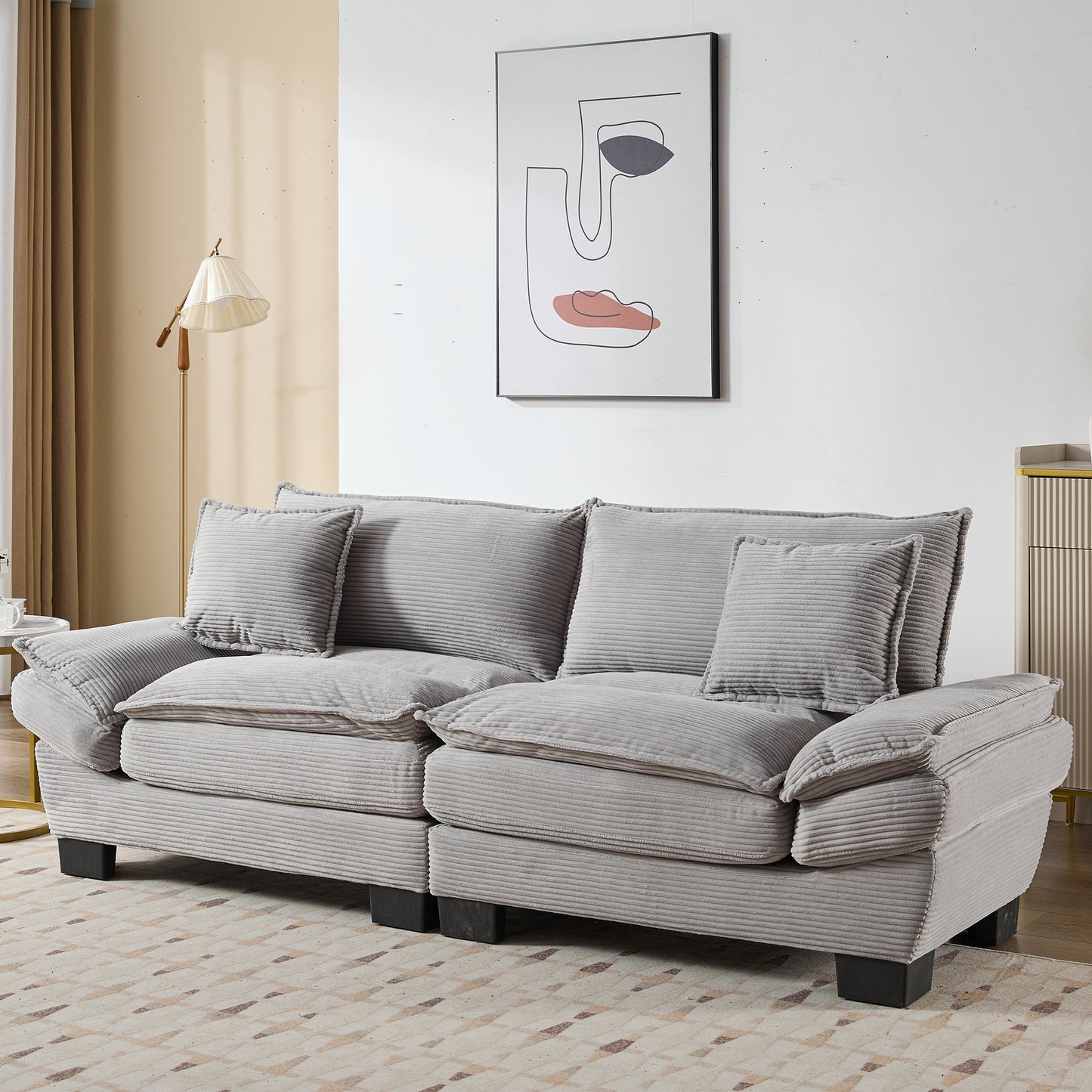 Plush grey corduroy sofa with deep seat cushions and matching throw pillows perfect for living rooms