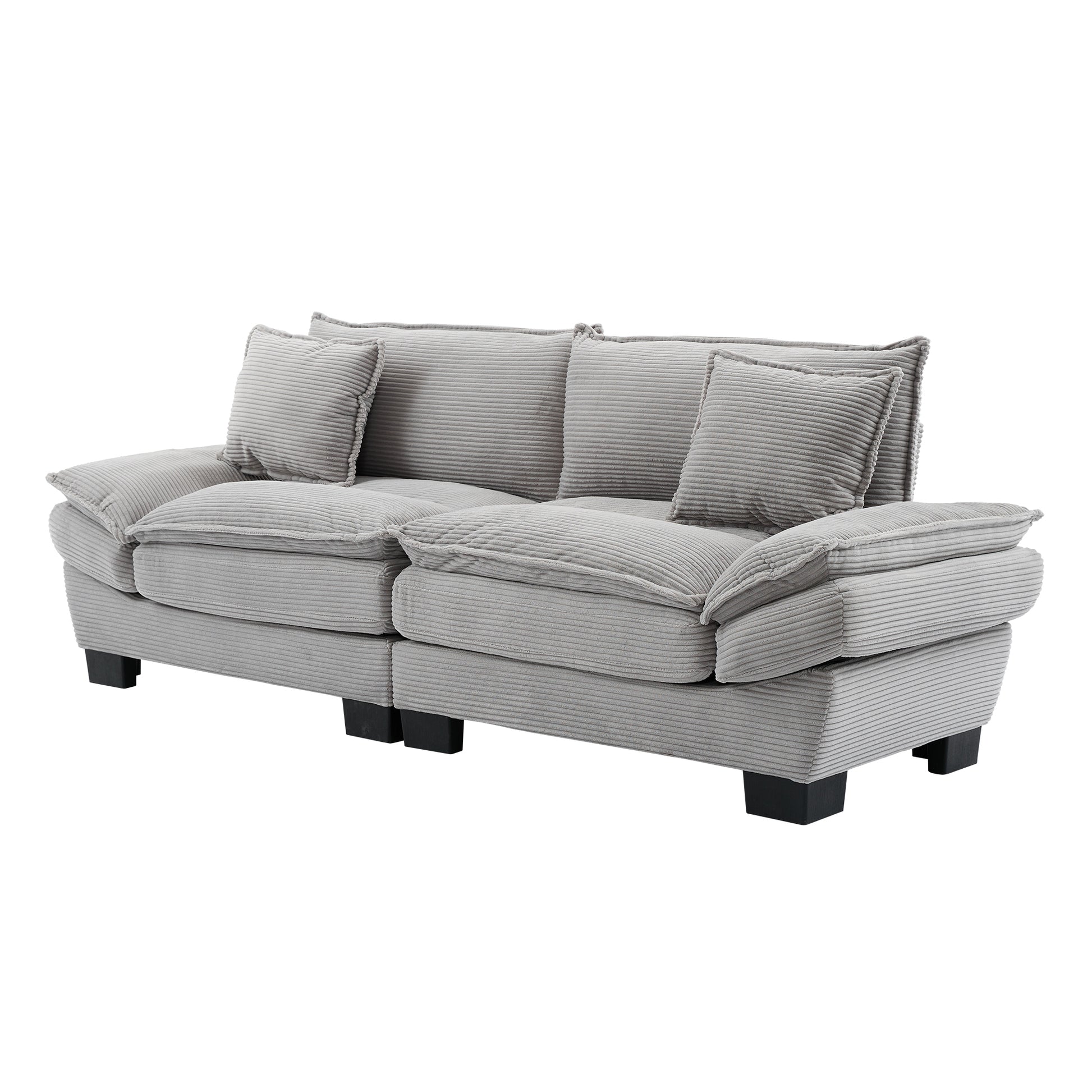 Plush grey corduroy sofa with two seat cushions and four throw pillows