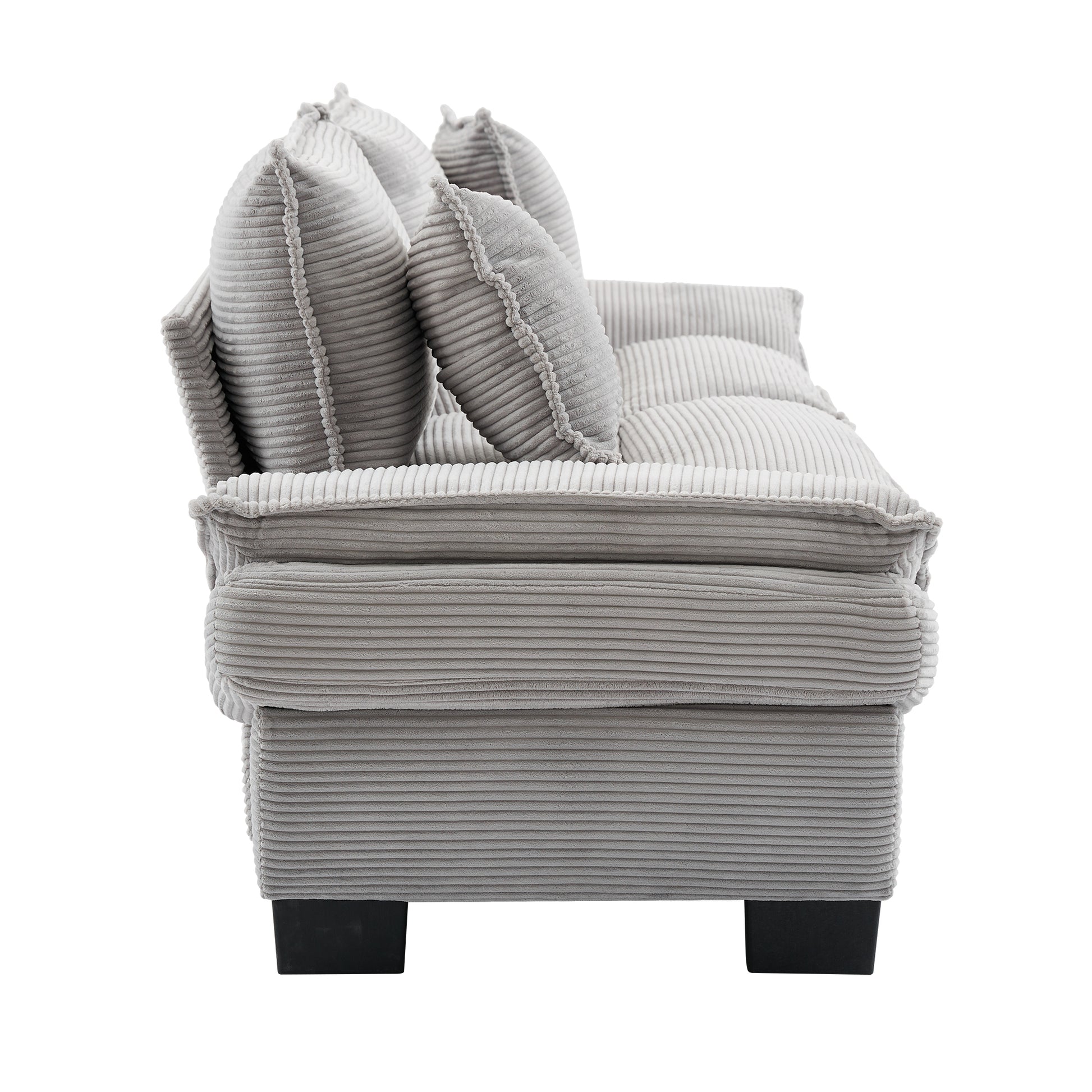 Gray corduroy sofa with plush throw pillows for ultimate comfort