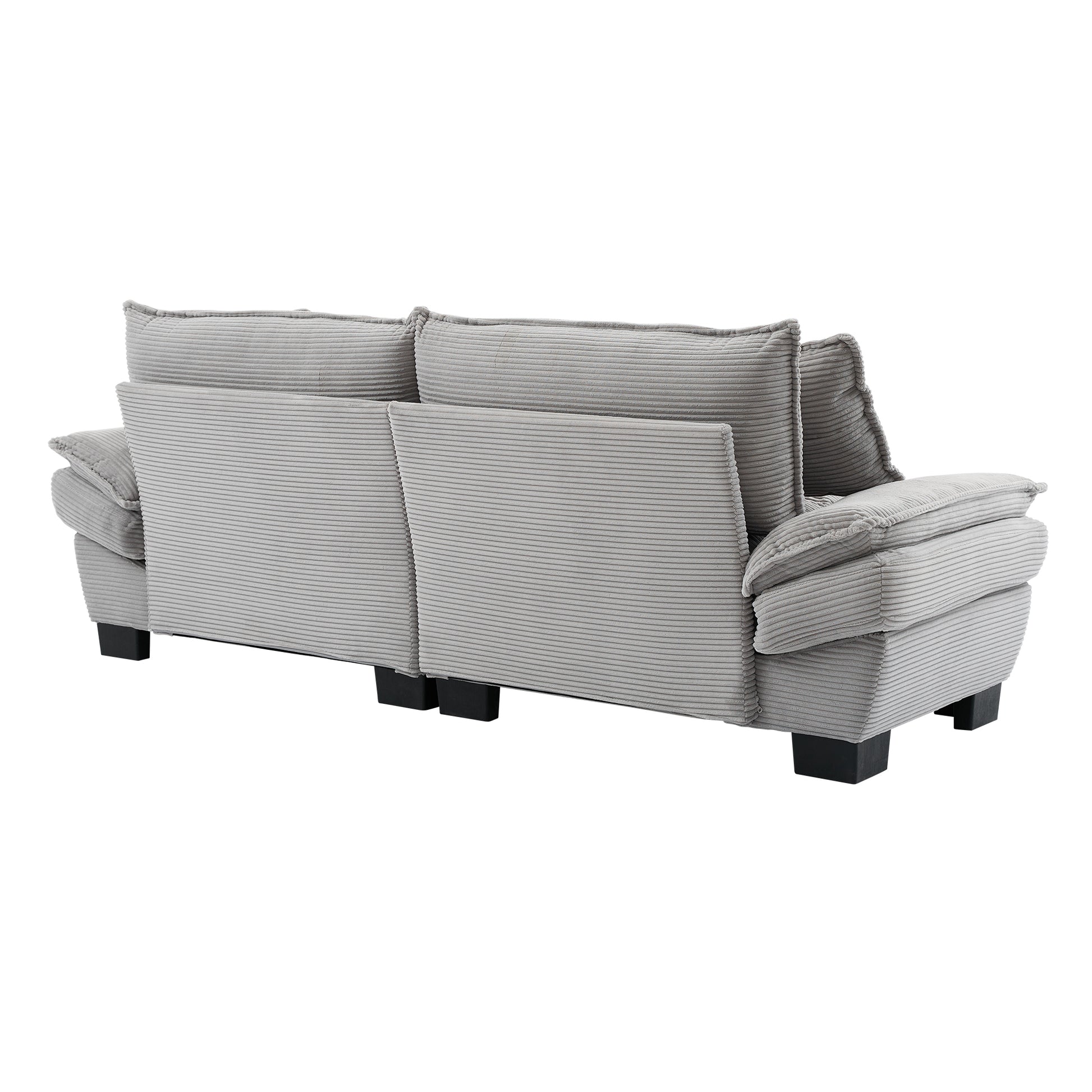Rear view of a light grey corduroy sofa with plush cushions and black block feet