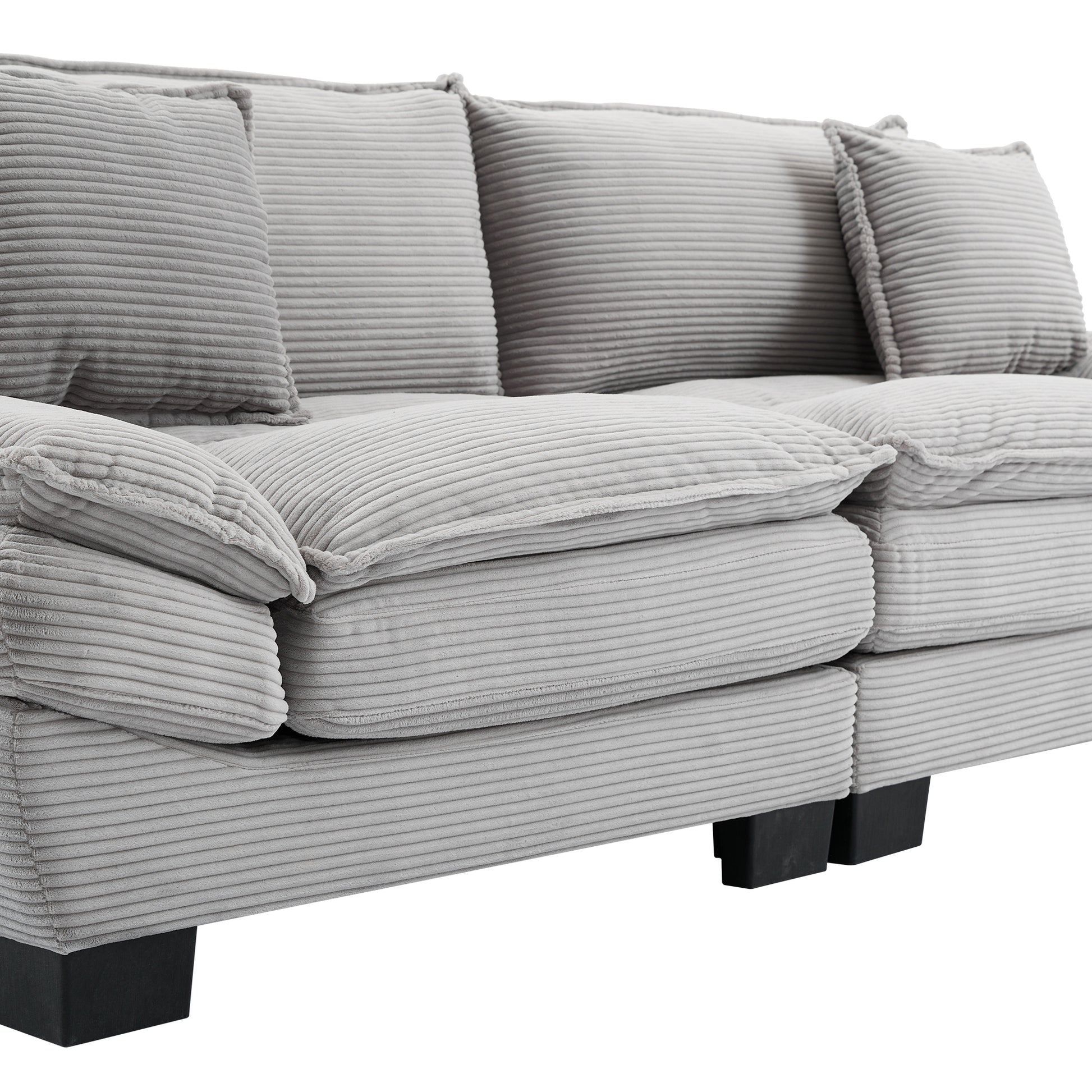 Gray corduroy sectional sofa with plush deep seats and matching throw pillows