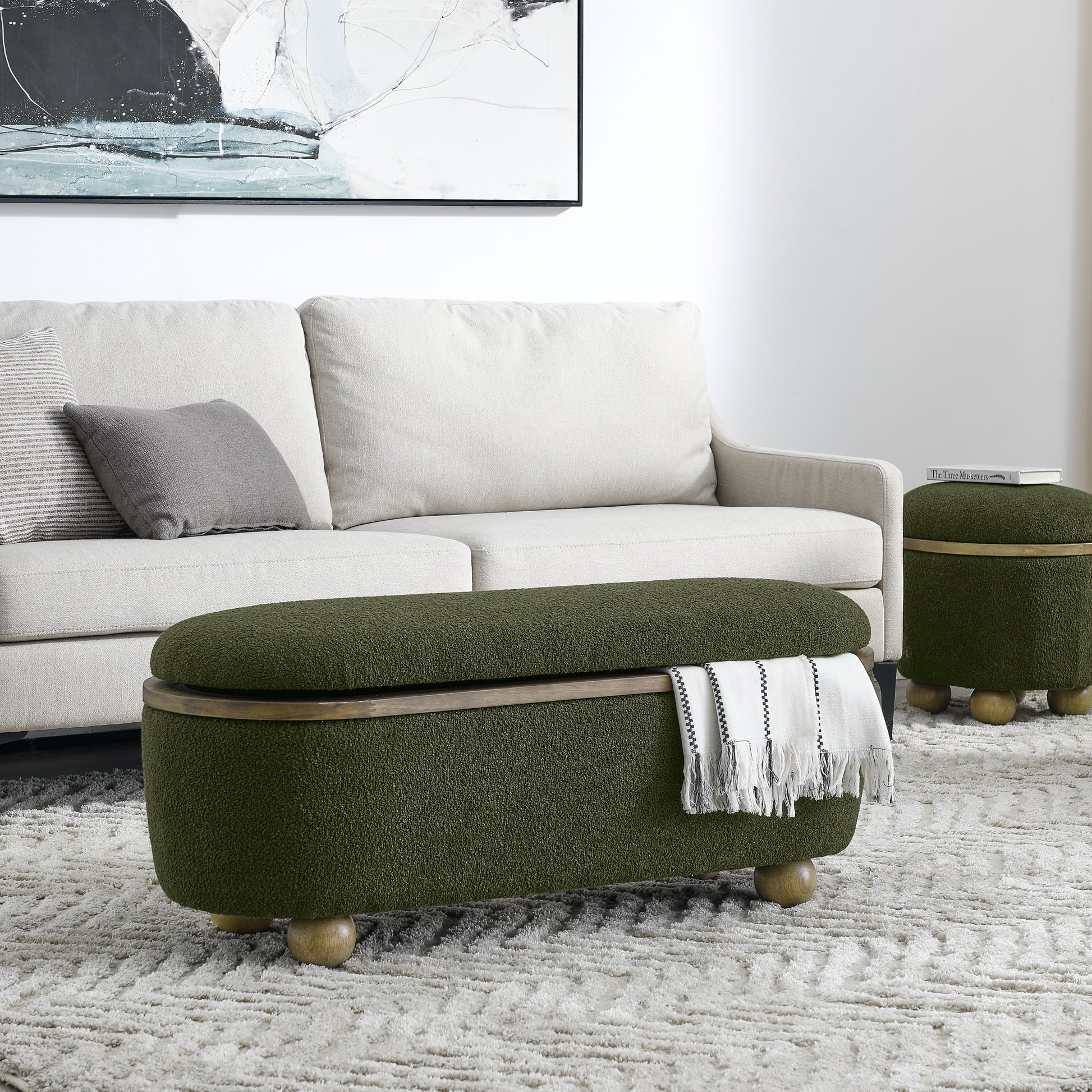 Olive green storage ottoman with wooden legs and a cozy textured finish