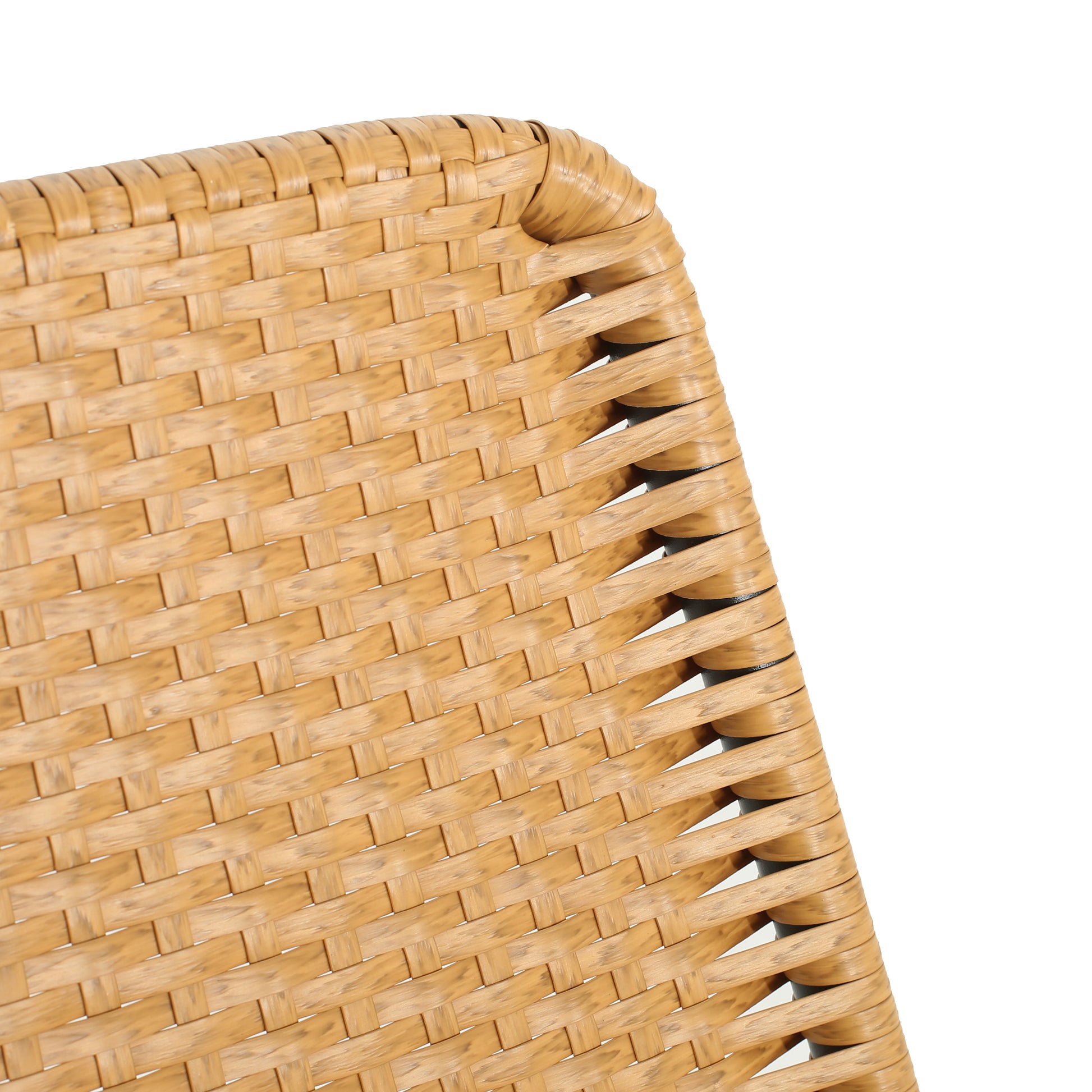 Closeup of natural woven rattan chair texture warm tan color for outdoor patio seating
